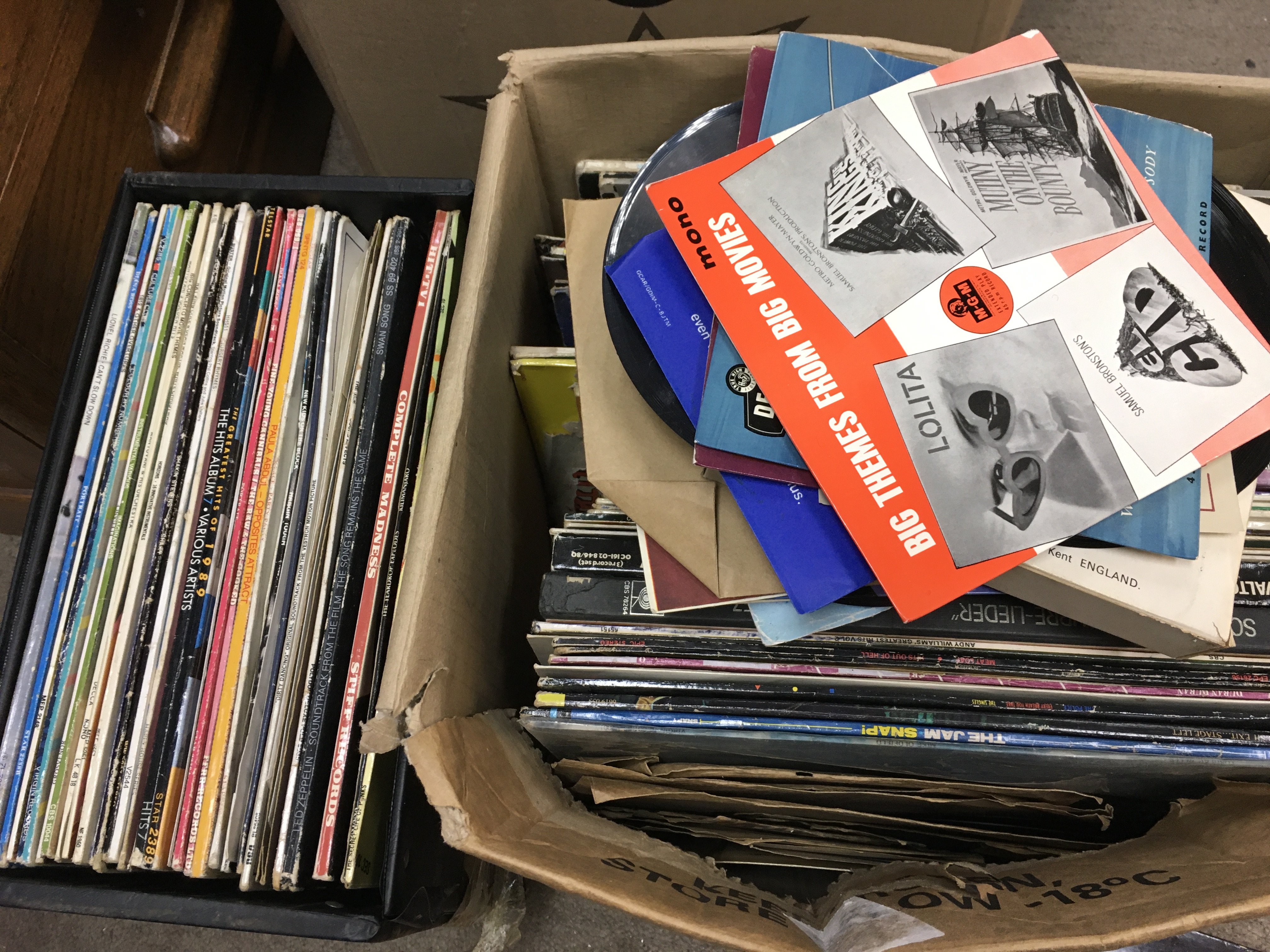 A collection of vinyl records including LPS and Singles by Black Sabbath, Rush, Peter Tosh, The Jam etc