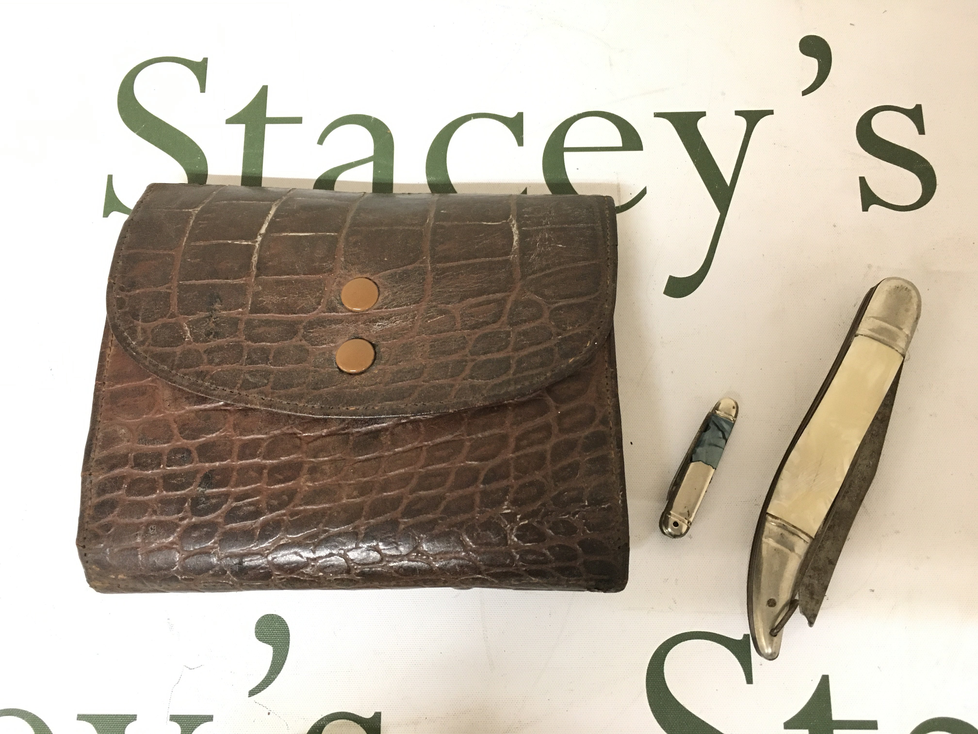 A leather Hardy Fly cast wallet , and a fish knife (German made blade). Postage category A