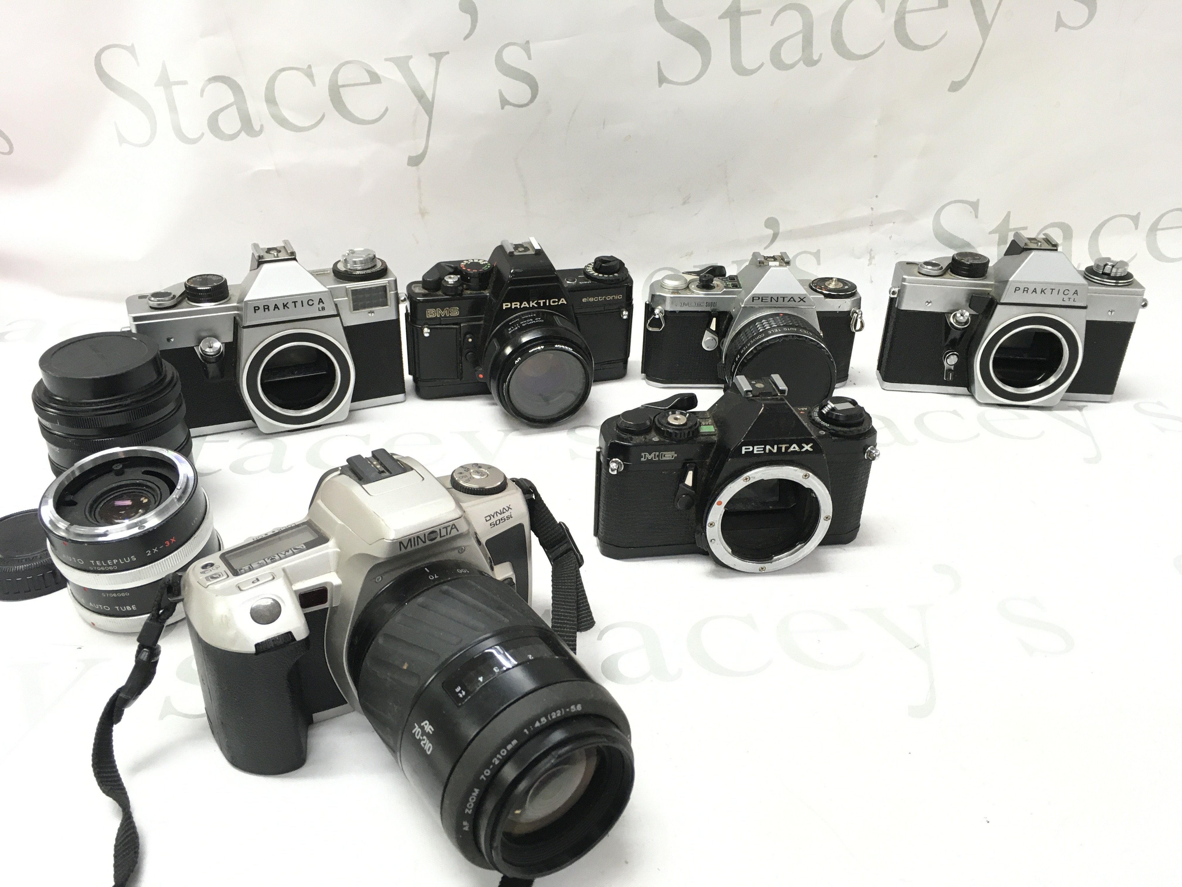 Six vintage SLR cameras including Pentax, Minolta etc. postage cat c
