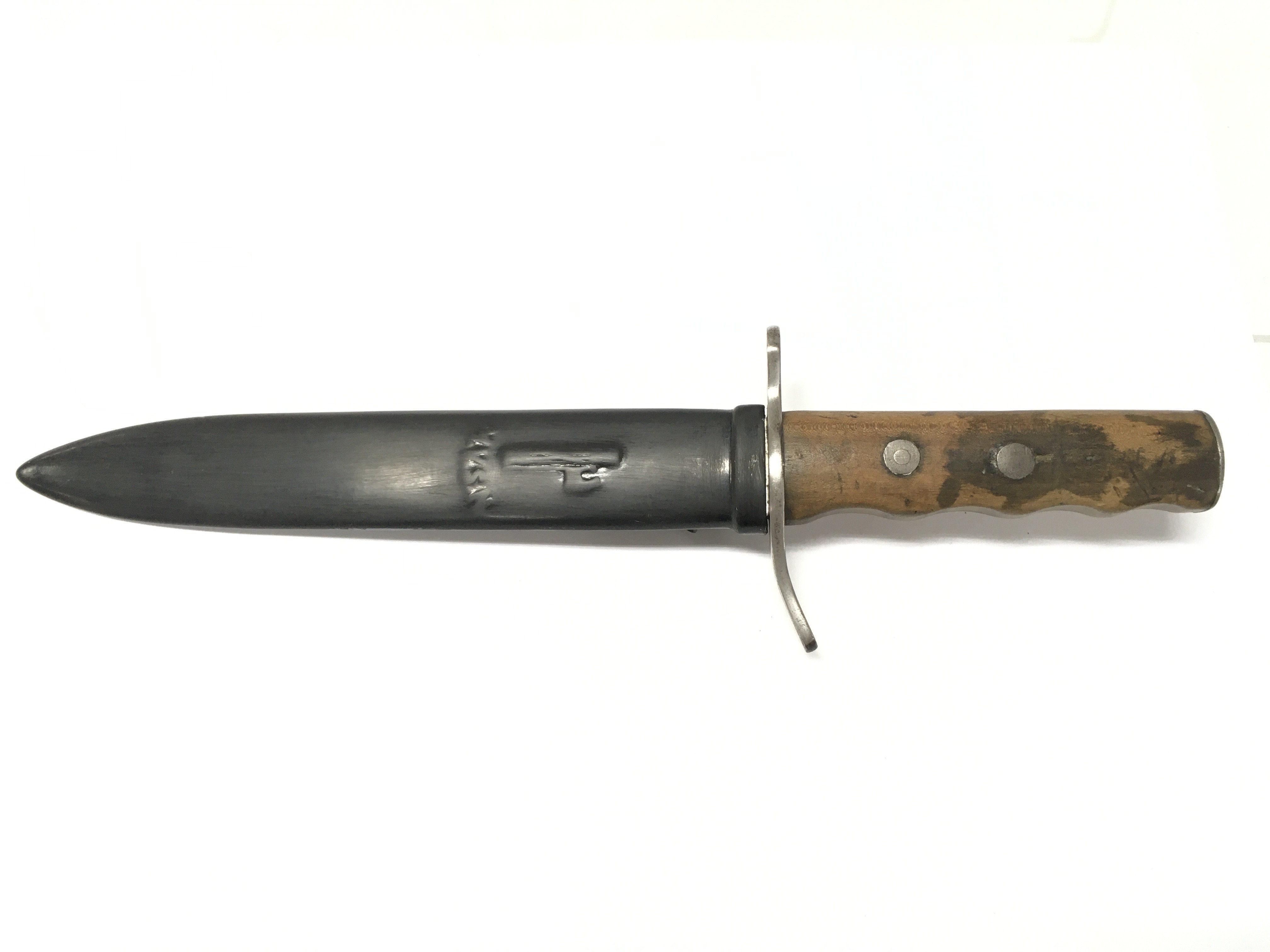 An Italian M.V.S.N fighting Knife , Taken from an Italian submarine 1943. blade Approx 21cm long. Total dagger length 32cm Approx. This lot cannot be posted