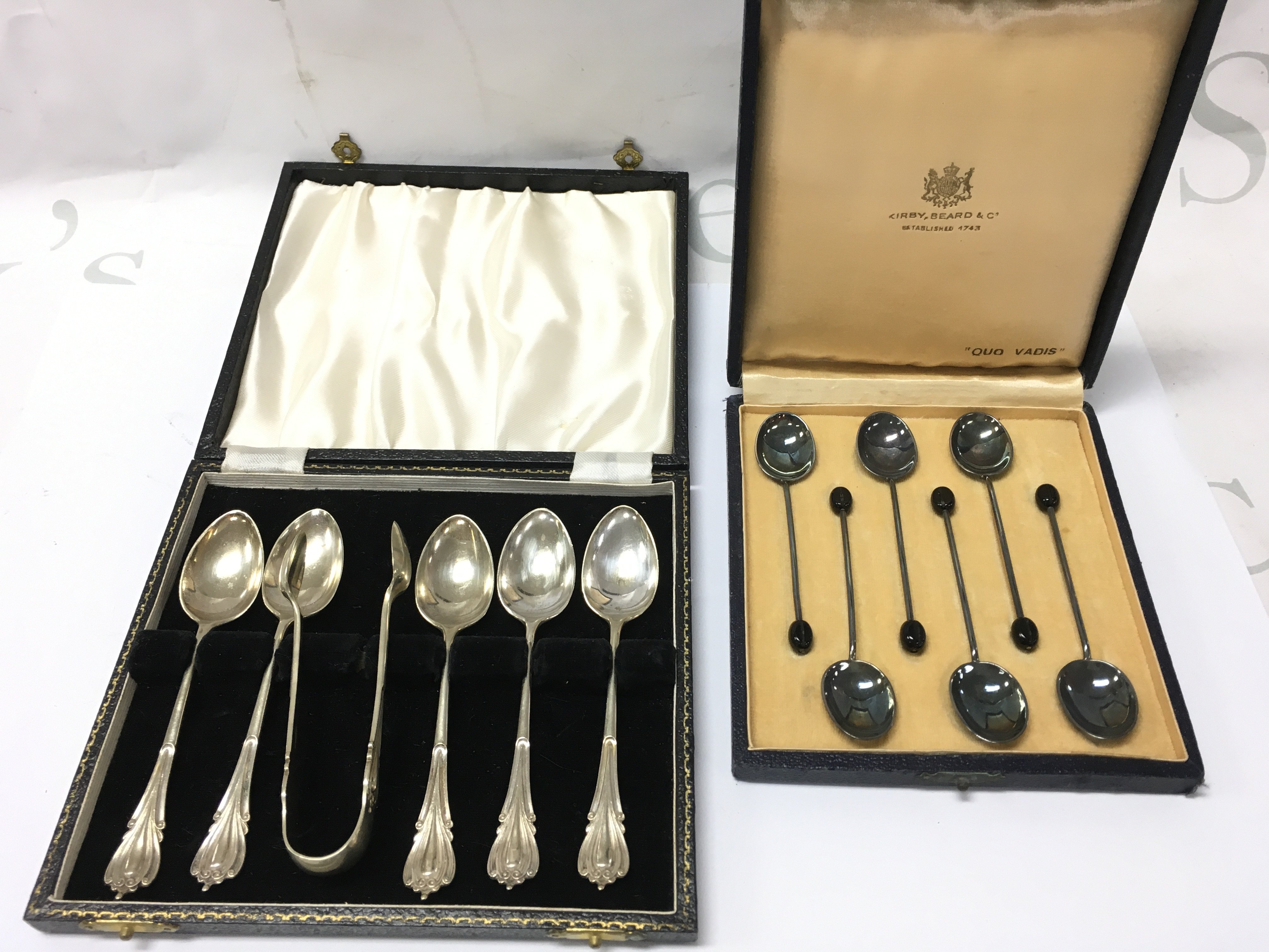Kirby boxed coffee spoons and another set of coffee spoons with sugar tongs . Postage category b