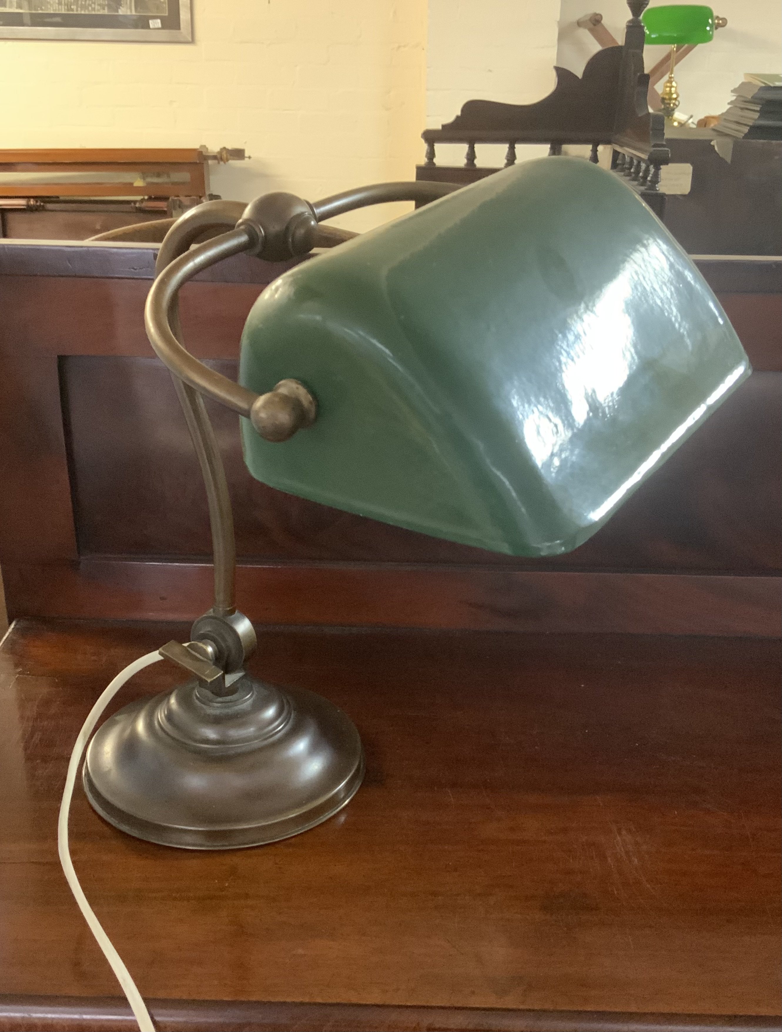 An original 1940s Siemens brass and enamel library desk lamp.
