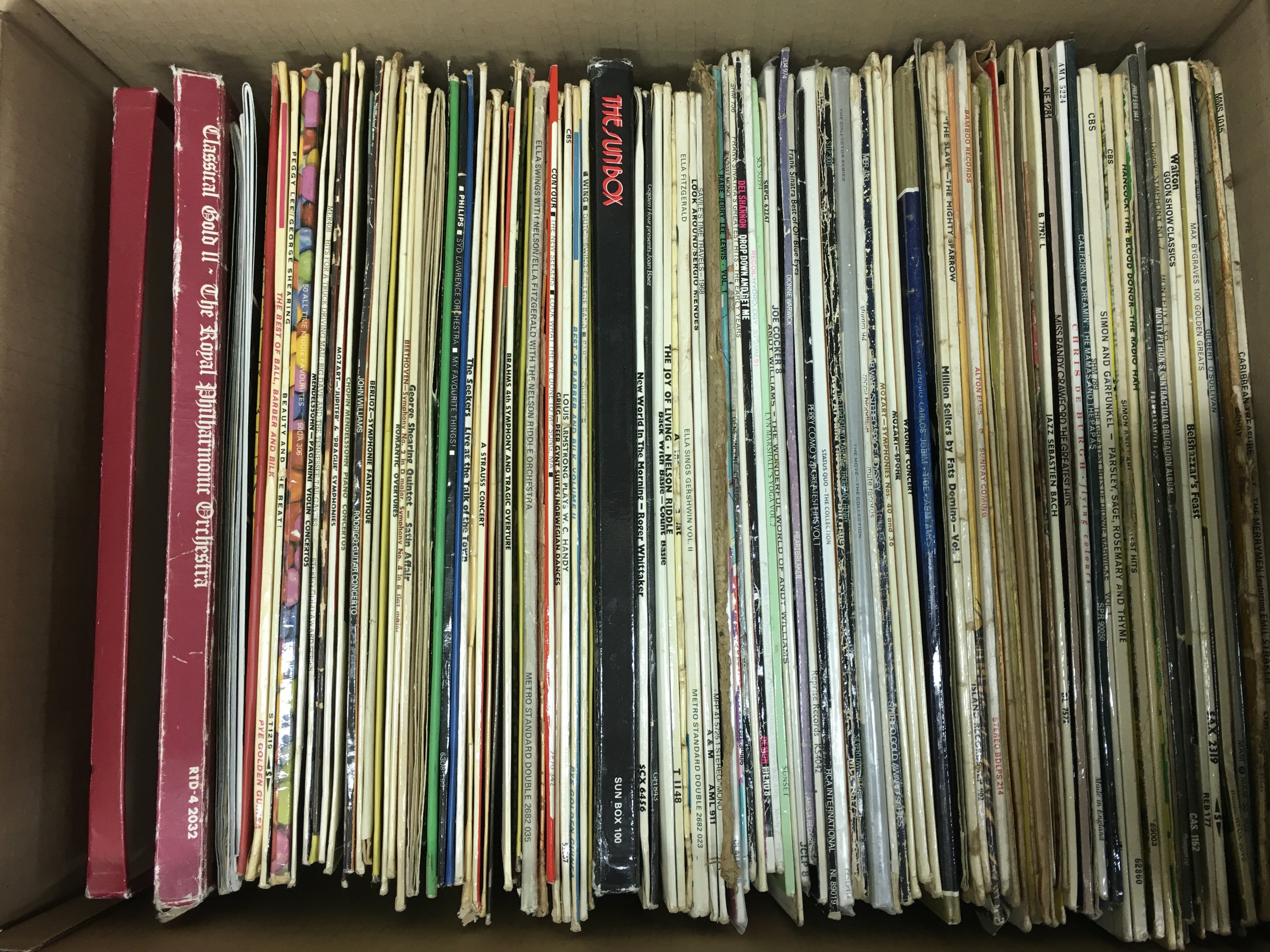 A box of LPs and 78s including Peggy lee, Sinatra, Ella Fitzgerald