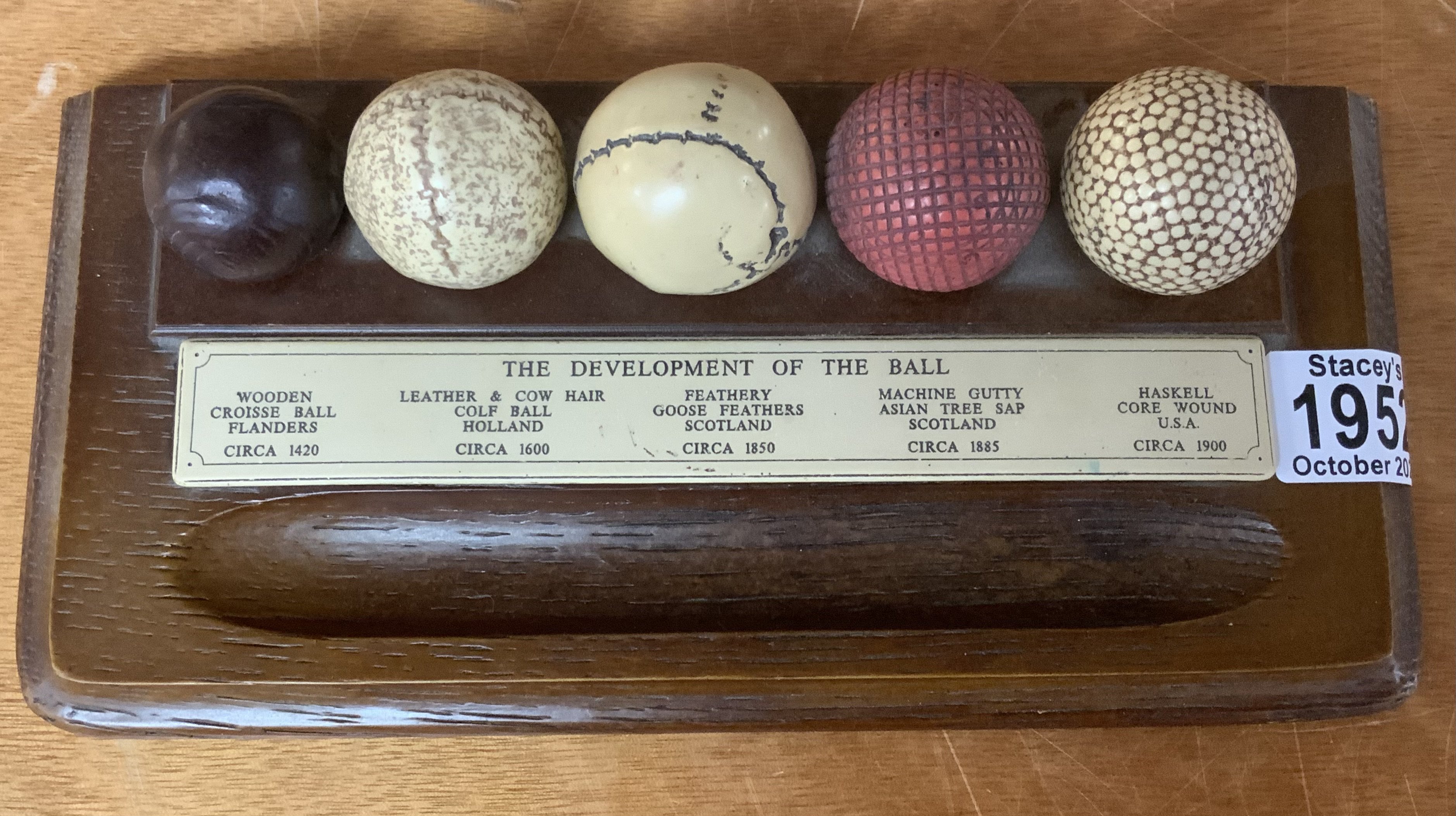 A novelty pen stand. The Development of the ball. (Golfing)