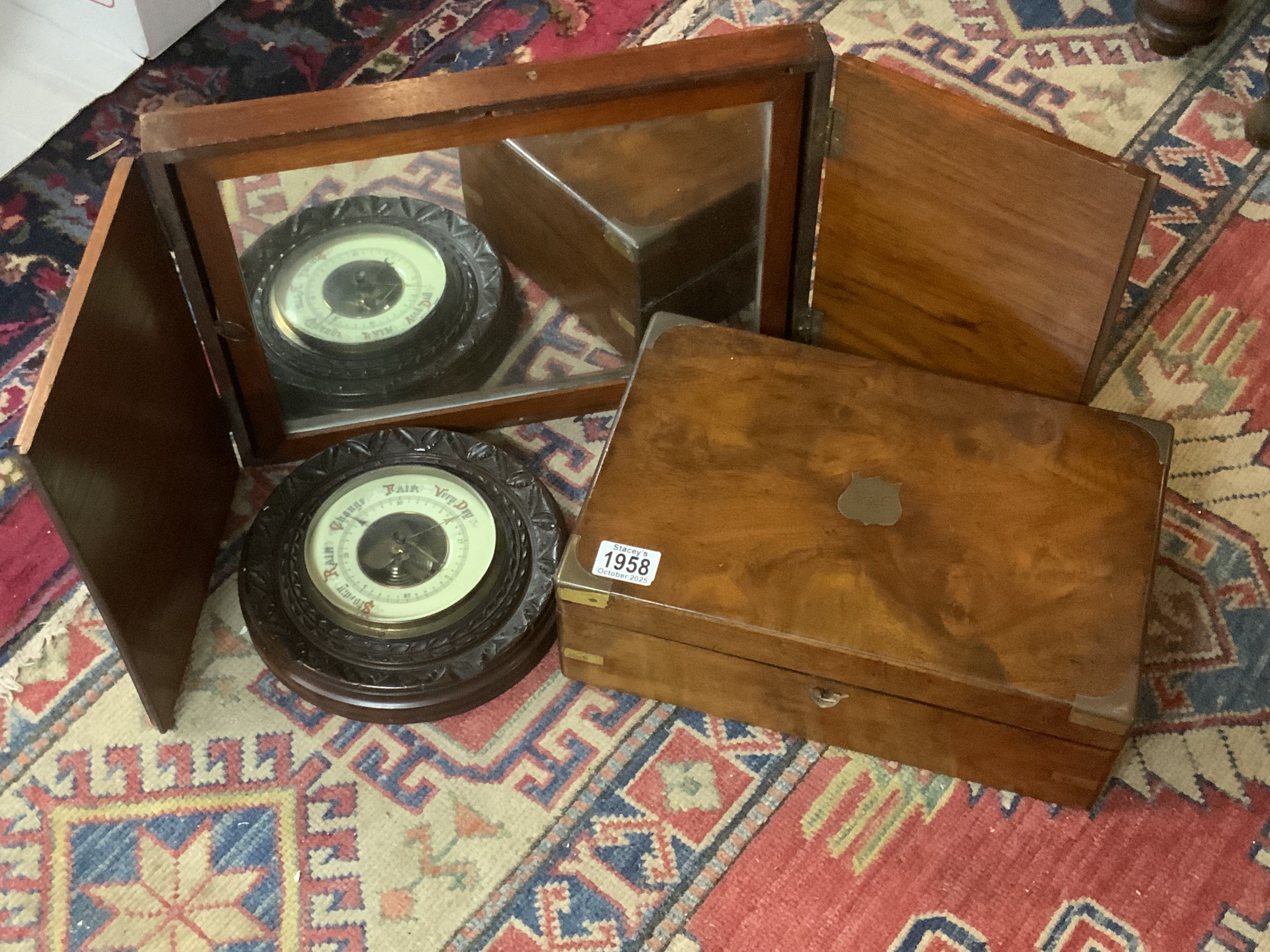 A vintage mahogany framed folding mirror, brass fitted writing slope, circular wall barometer.