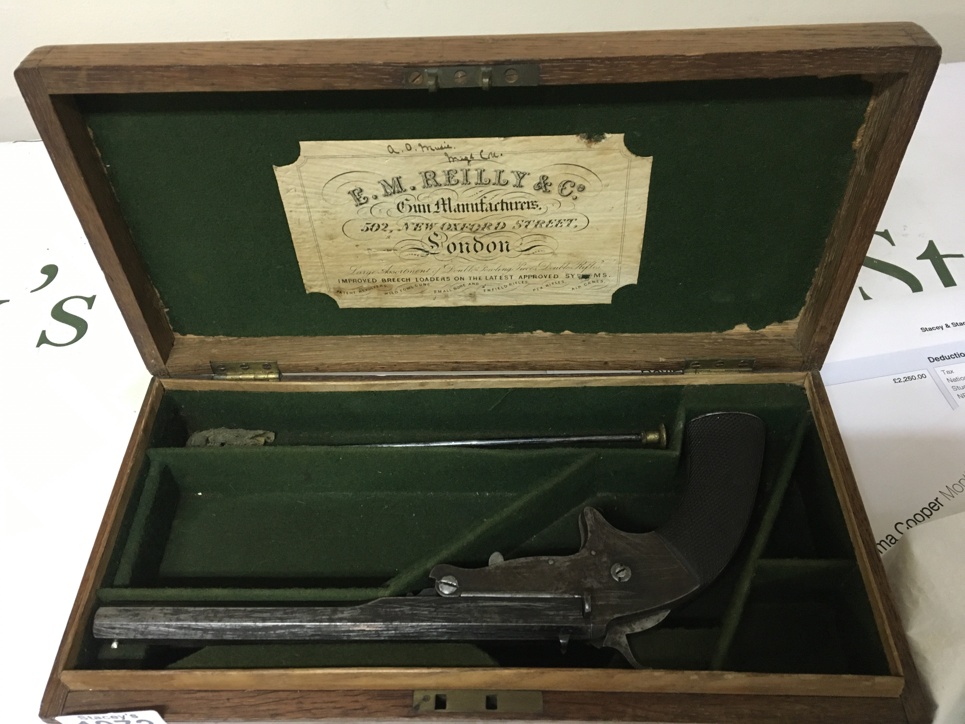 A Victorian single Target Pistol maker E M Reilly & Co New Oxford Street London the pistol with an octagonal barrel engraved with EM Reilly & Co maker patent stamp 1758. With a nice original oak fitted box with cleaning rod. .320 caliber. Stamped on the barrel breech load. Total length 28cm scratches to the barrel A FIREARMS LICENSE IS REQUIRED TO BUY THIS LOT VIEWING AND COLLECTION BY APPOINTMENT ONLY.