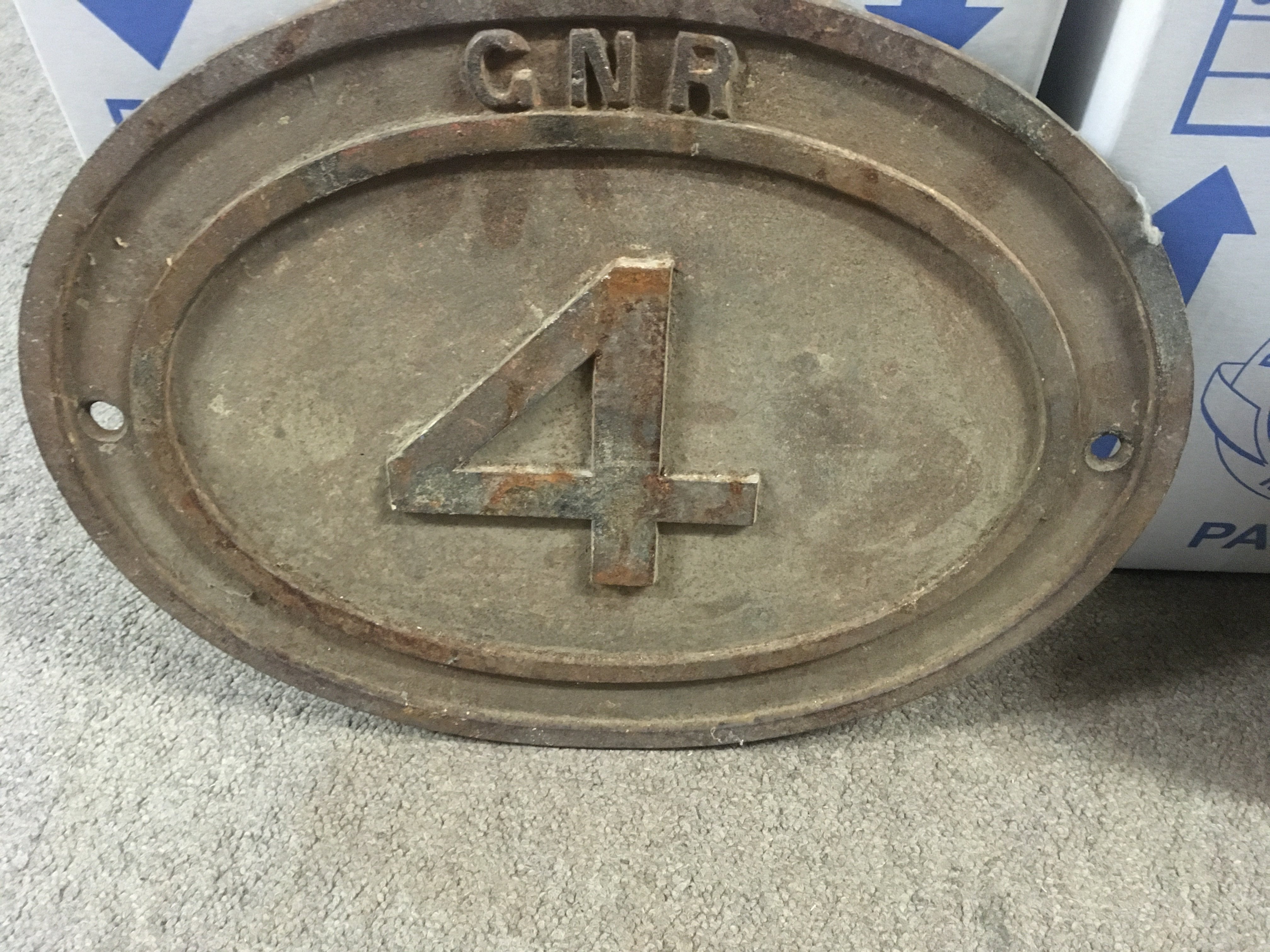 A oval cast iron railway GNR bridge plate, No 4