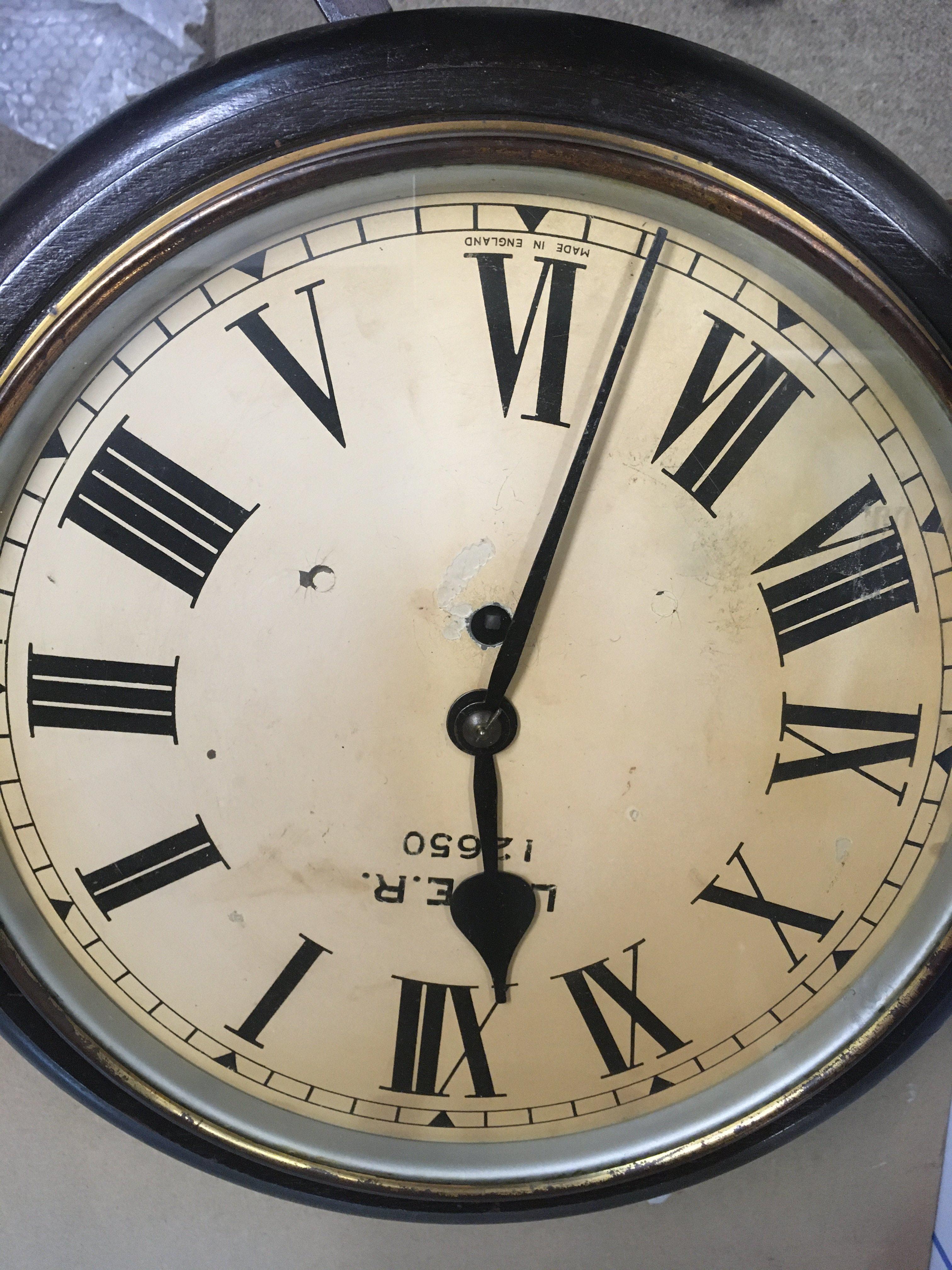 A station LNER mahogany wall clock , the dial with Roman numerals.