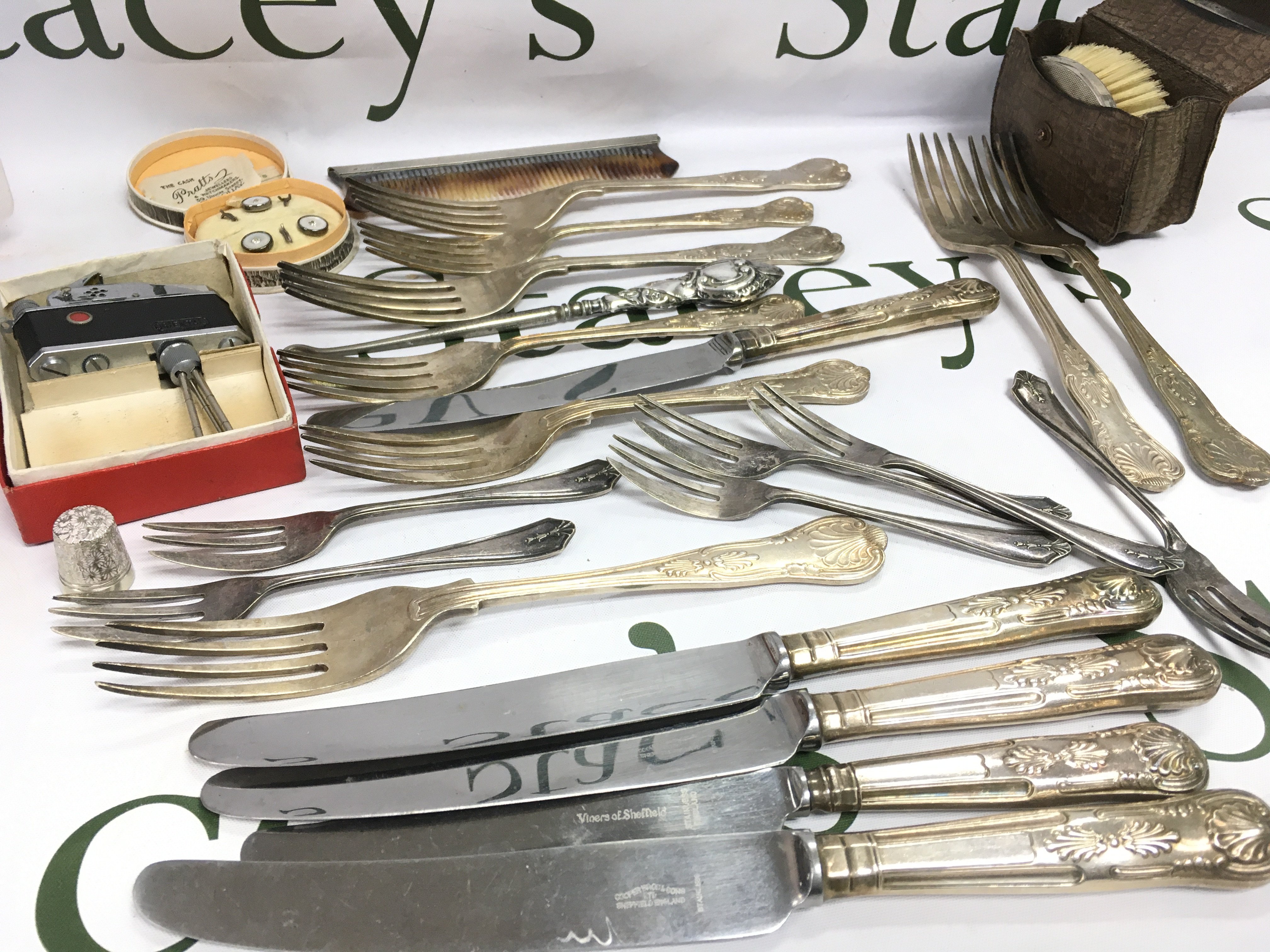 Collection of silver and silver plate including a silver handled crochet hook, silver handled comb and brush, Viners cutlery, novelty camera lighter etc Postage category B
