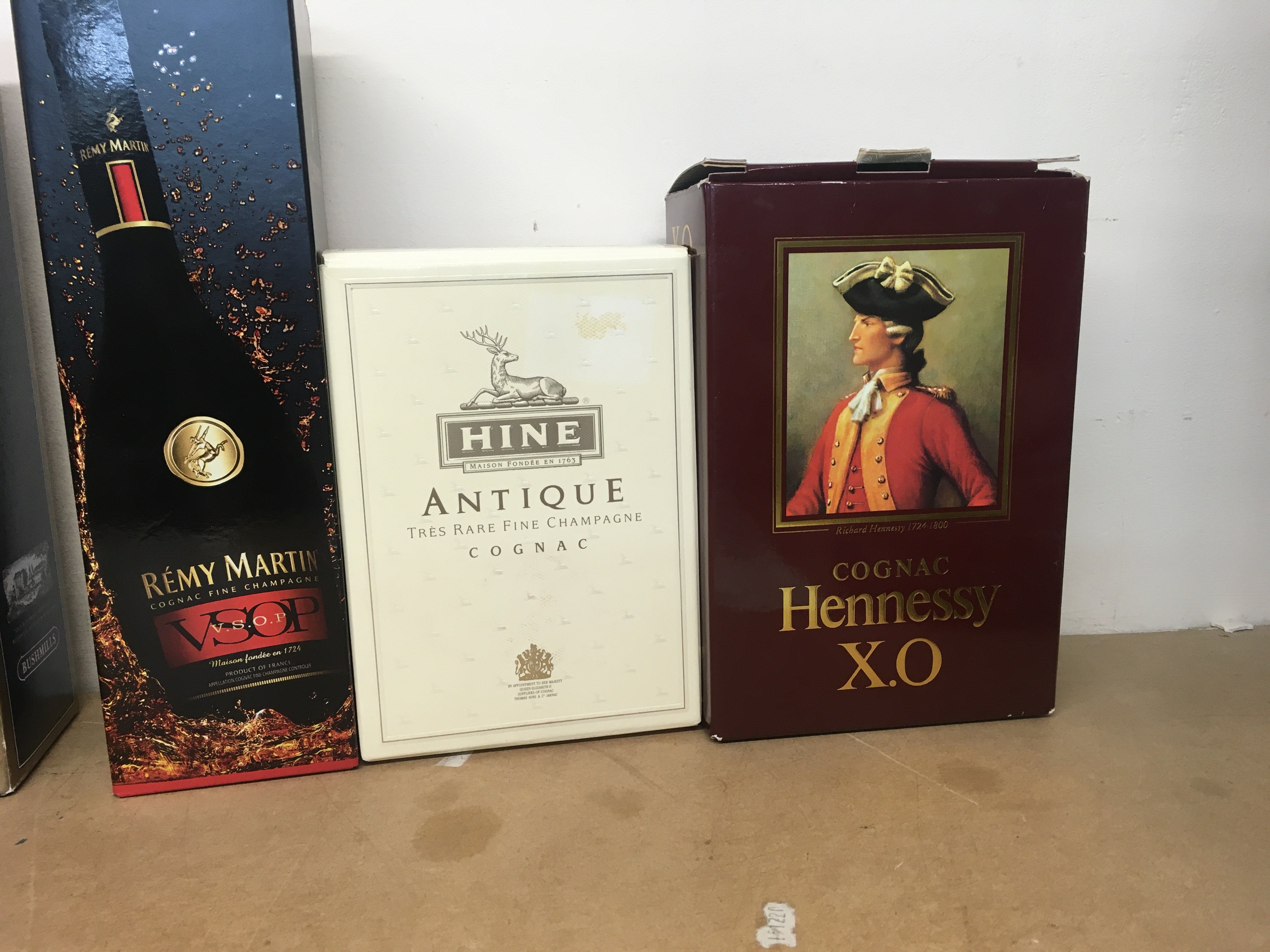 Three bottles of cognac .