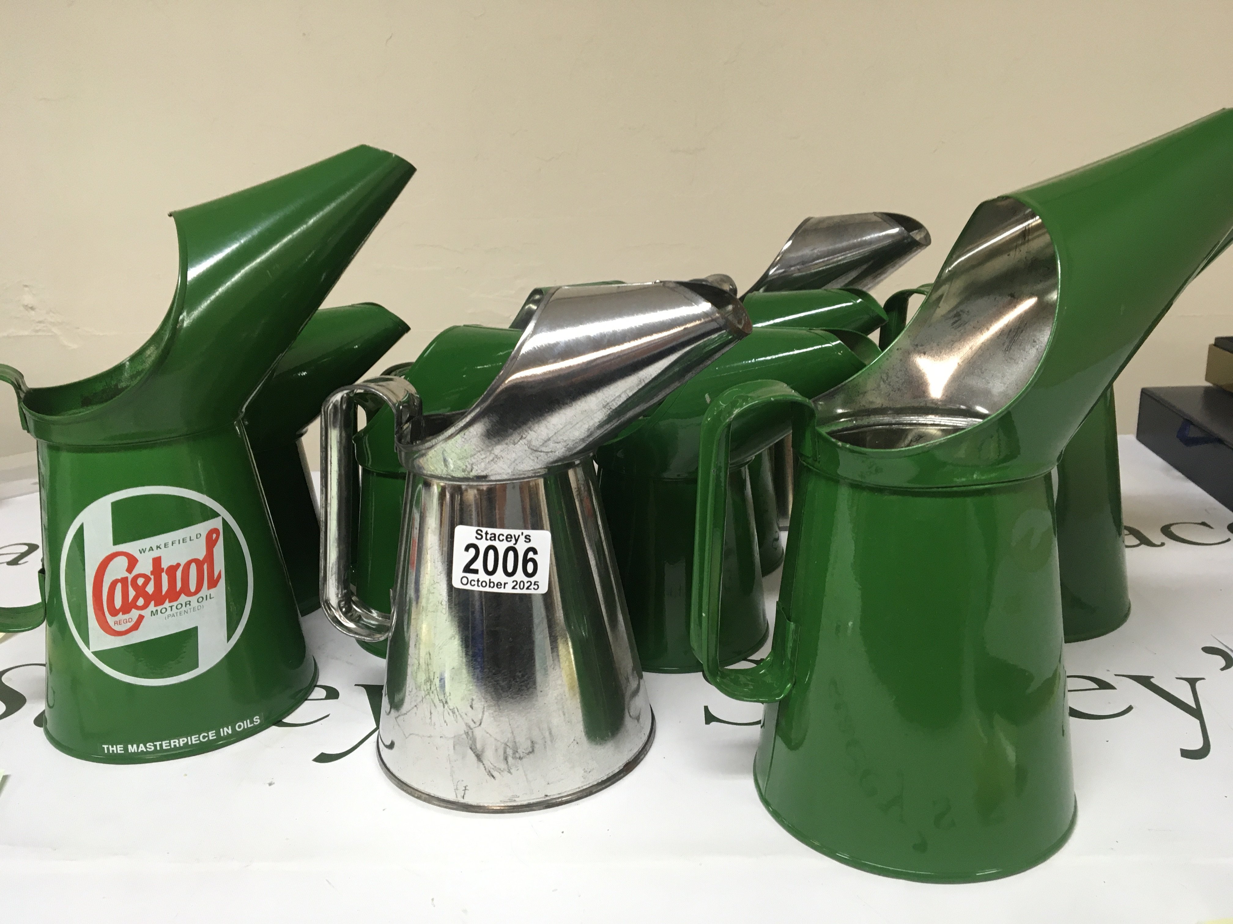 A collection of unused Castrol motor oil cans Quarter and pint size some unpainted and without Castrol badge.