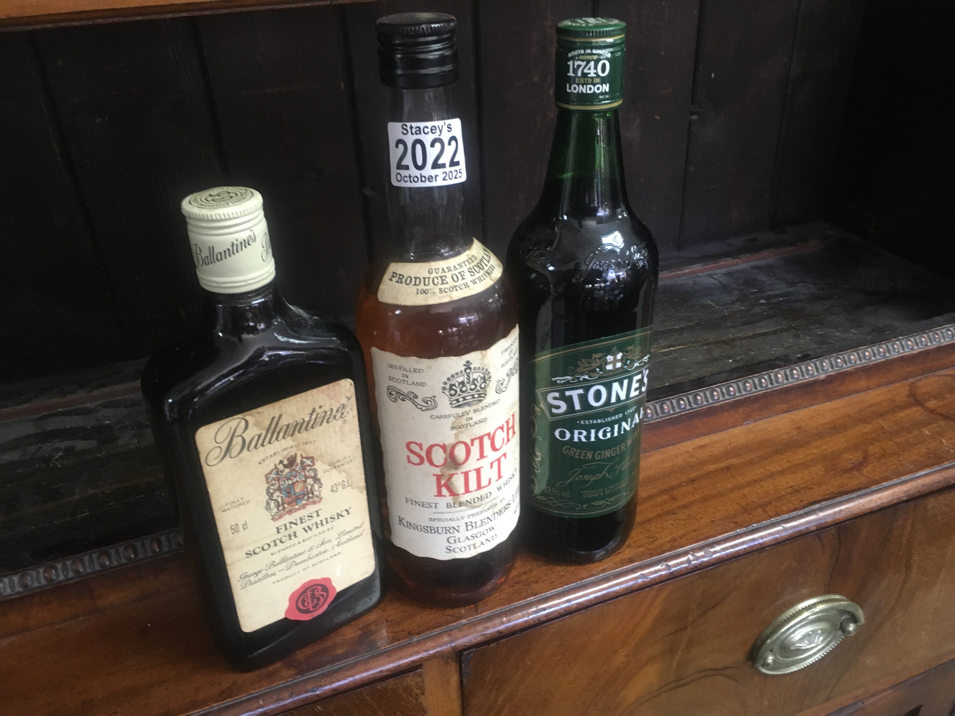 Three bottles of alcohol including scotch Kilt .