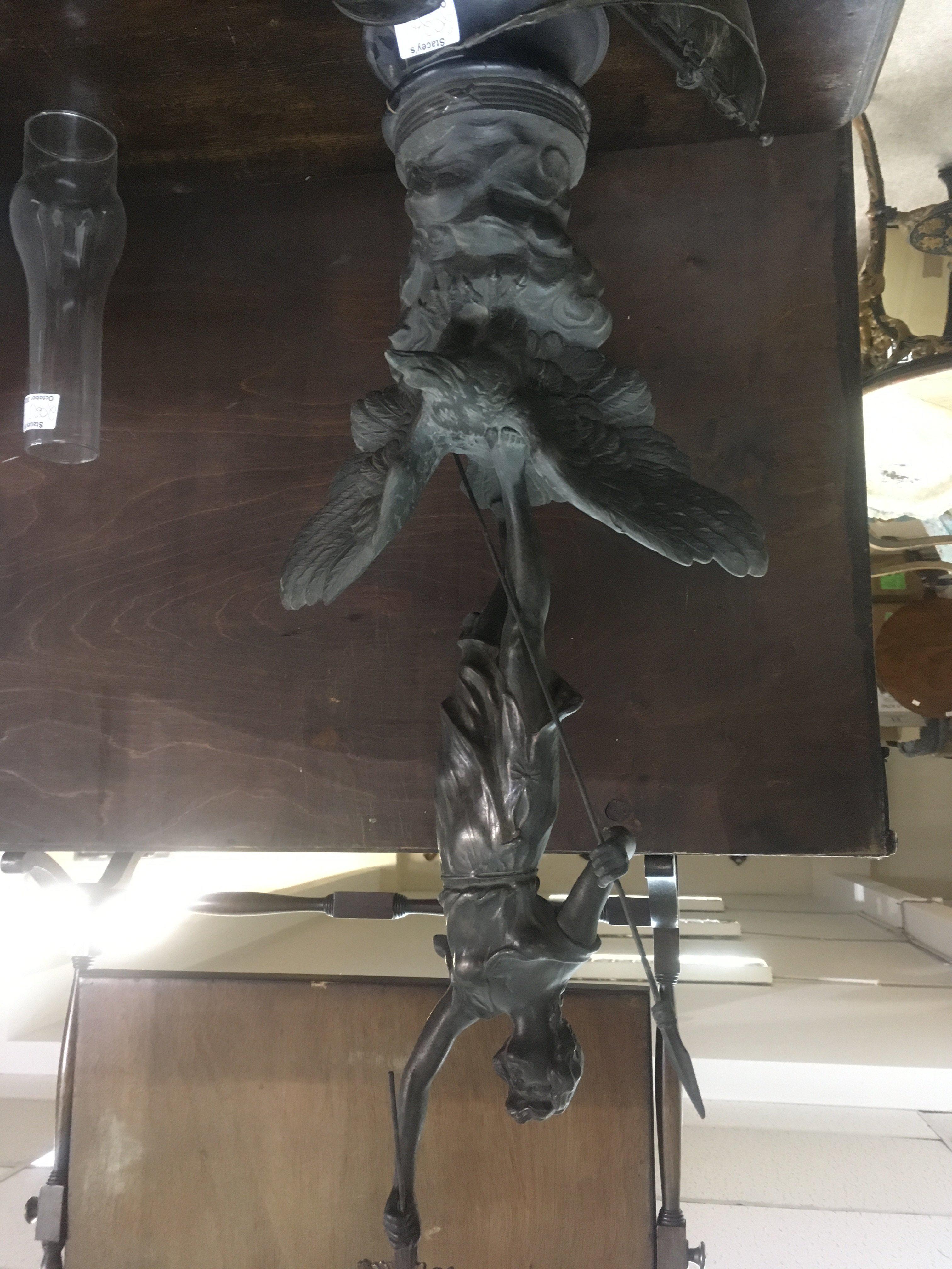 A spelter figure in the form of a classic figure in the style of Ernest Barrias together with a a spelter single mast gallon.