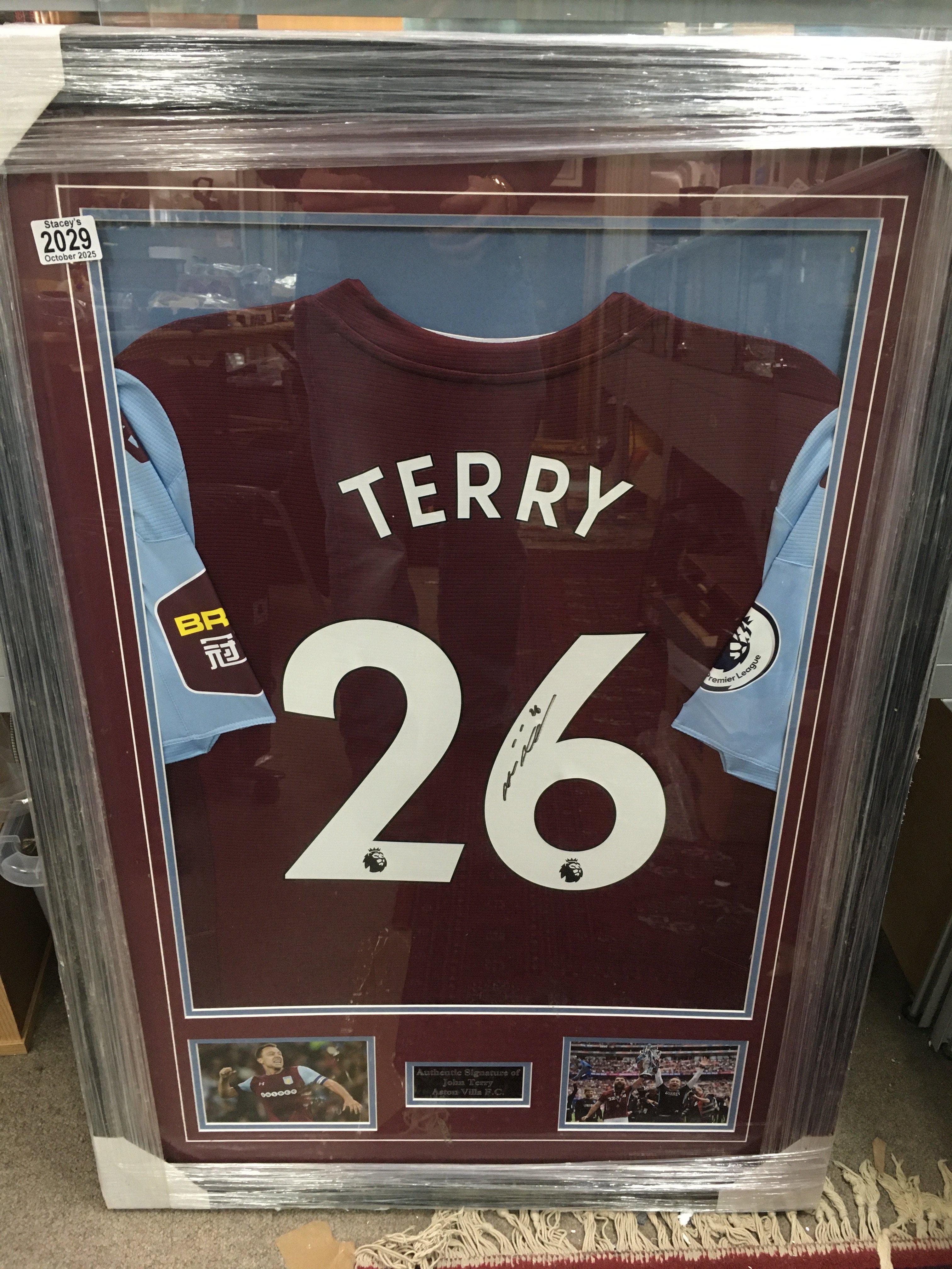 A framed and signed John Terry Aston Villa F.C shirt. Frame size 67x96cm.