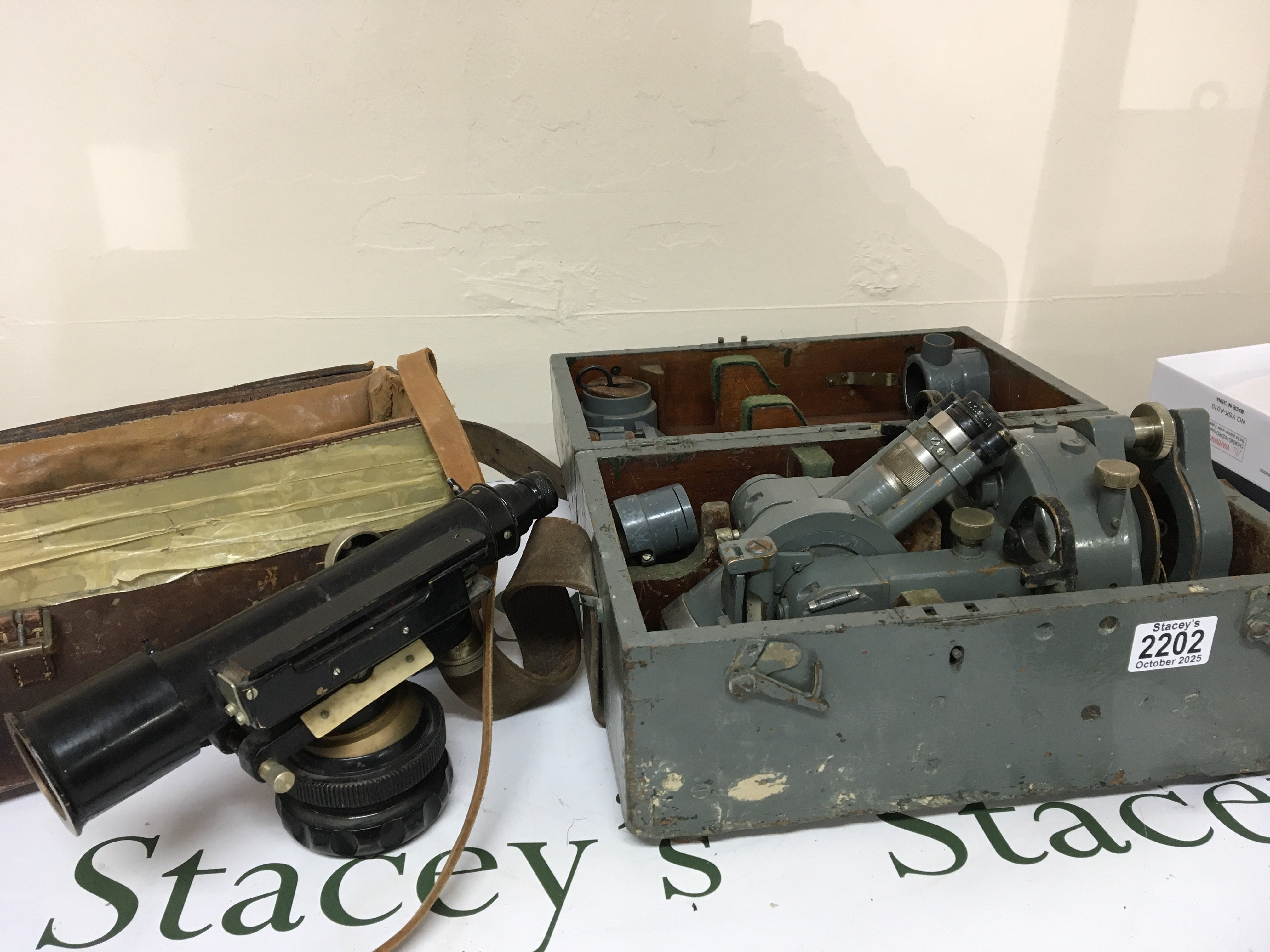 A Vintage Theodolite possibly Air Ministry issue maker Cooke Troughton & Simms in a fitted case with accessories. And a leather case containing a Vintage civil engineers Dumpy Level. (2)