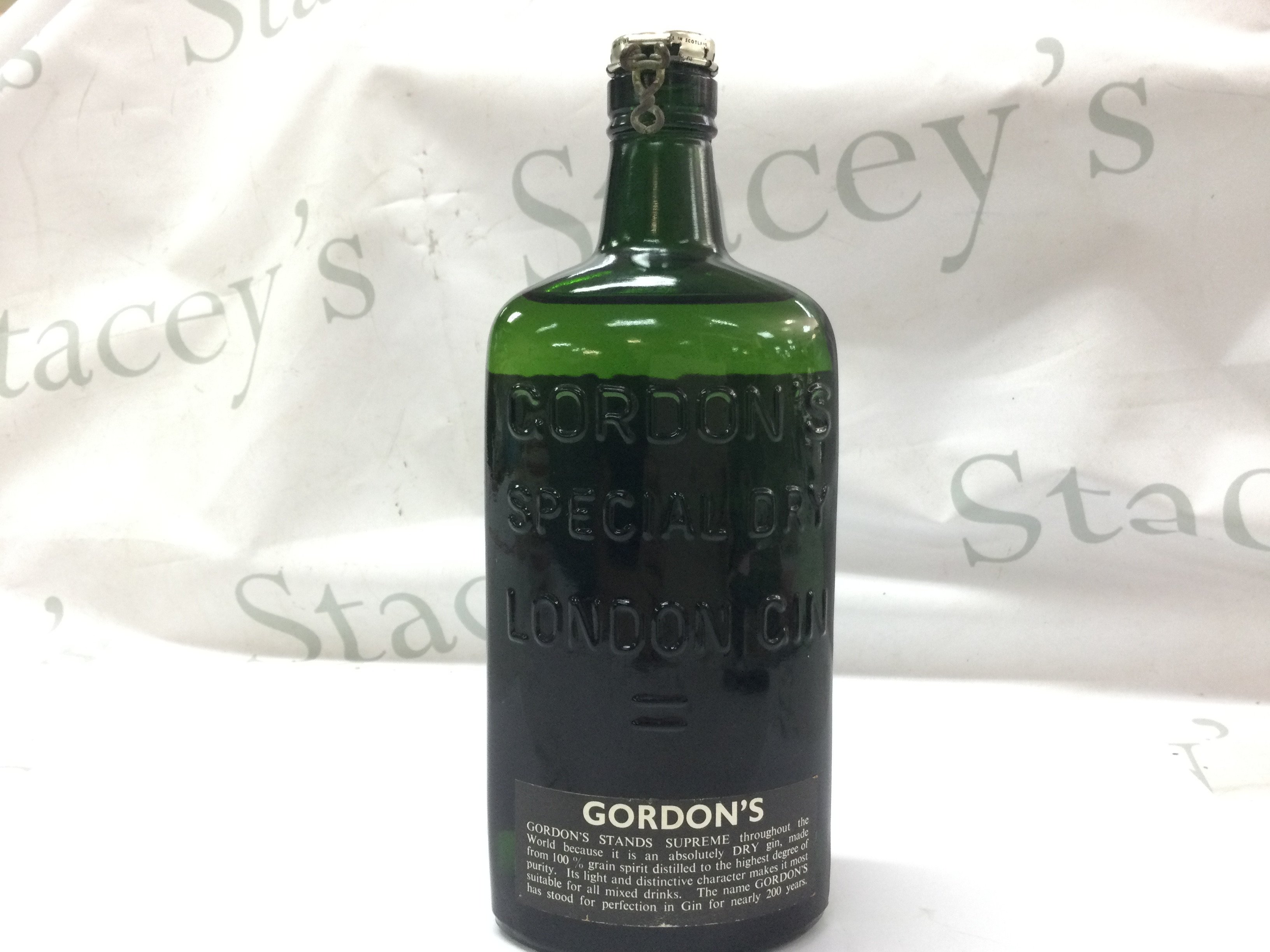 A vintage bottle of Gordons Gin. This lot cannot be posted