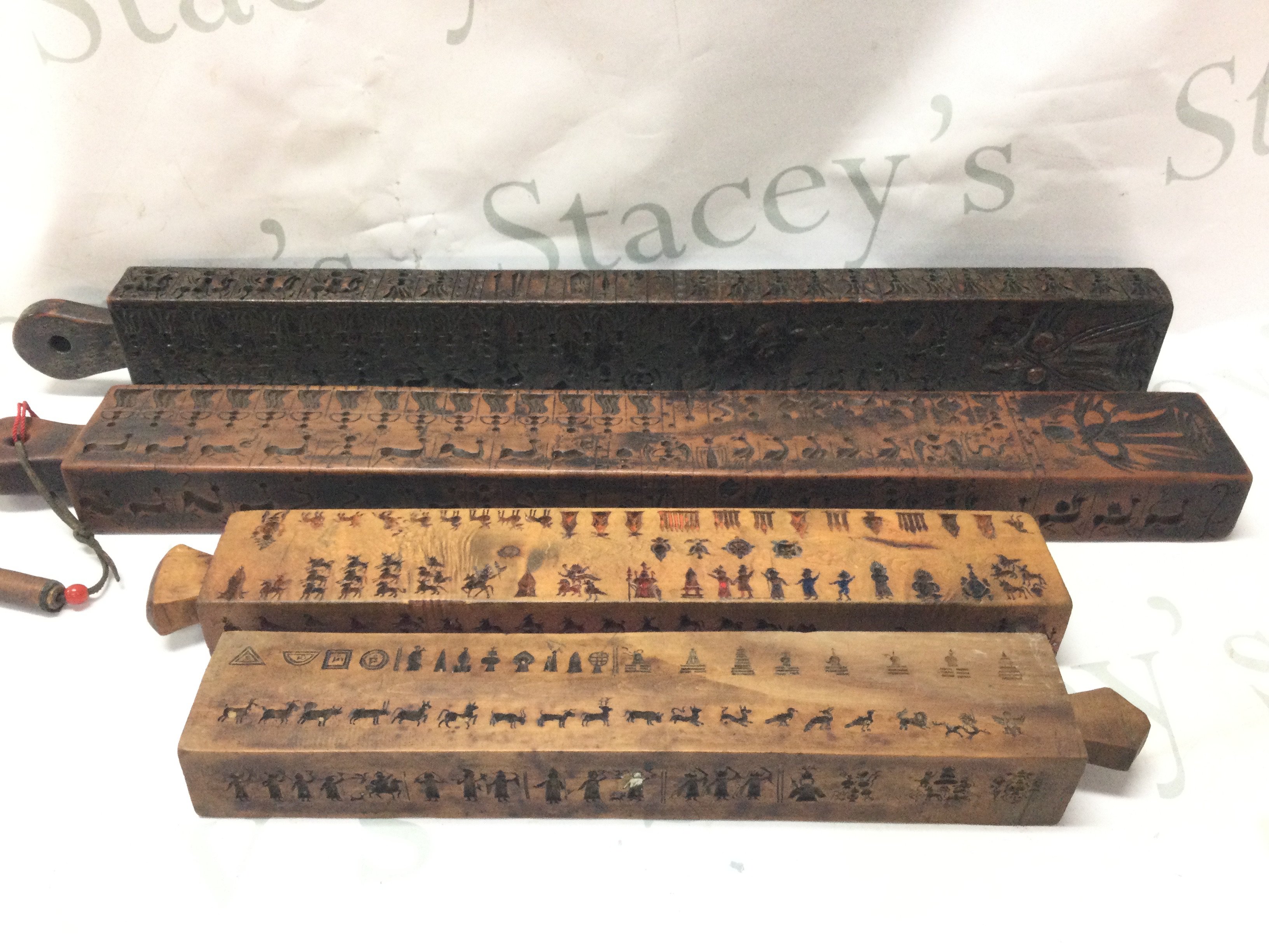 19th century Tibetan Votive Wafer models carved auspicious symbols . Postage category C