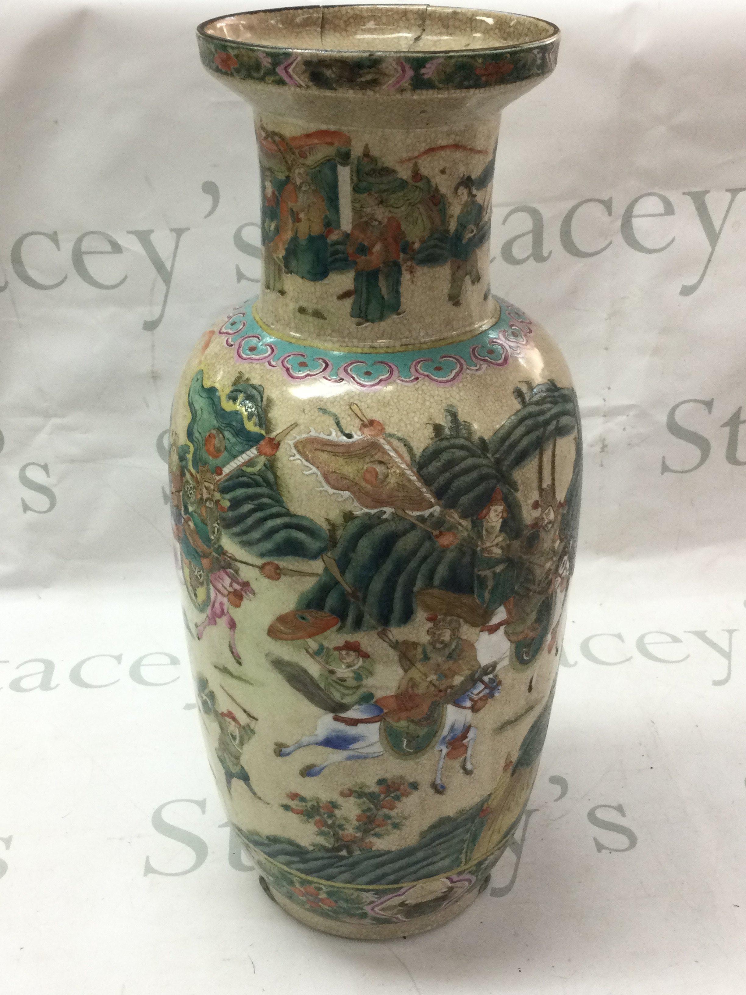 A Chinese cracked glaze vase , With a 6 character mark on base , damage on top of vase. 44cm tall .This lot cannot be posted