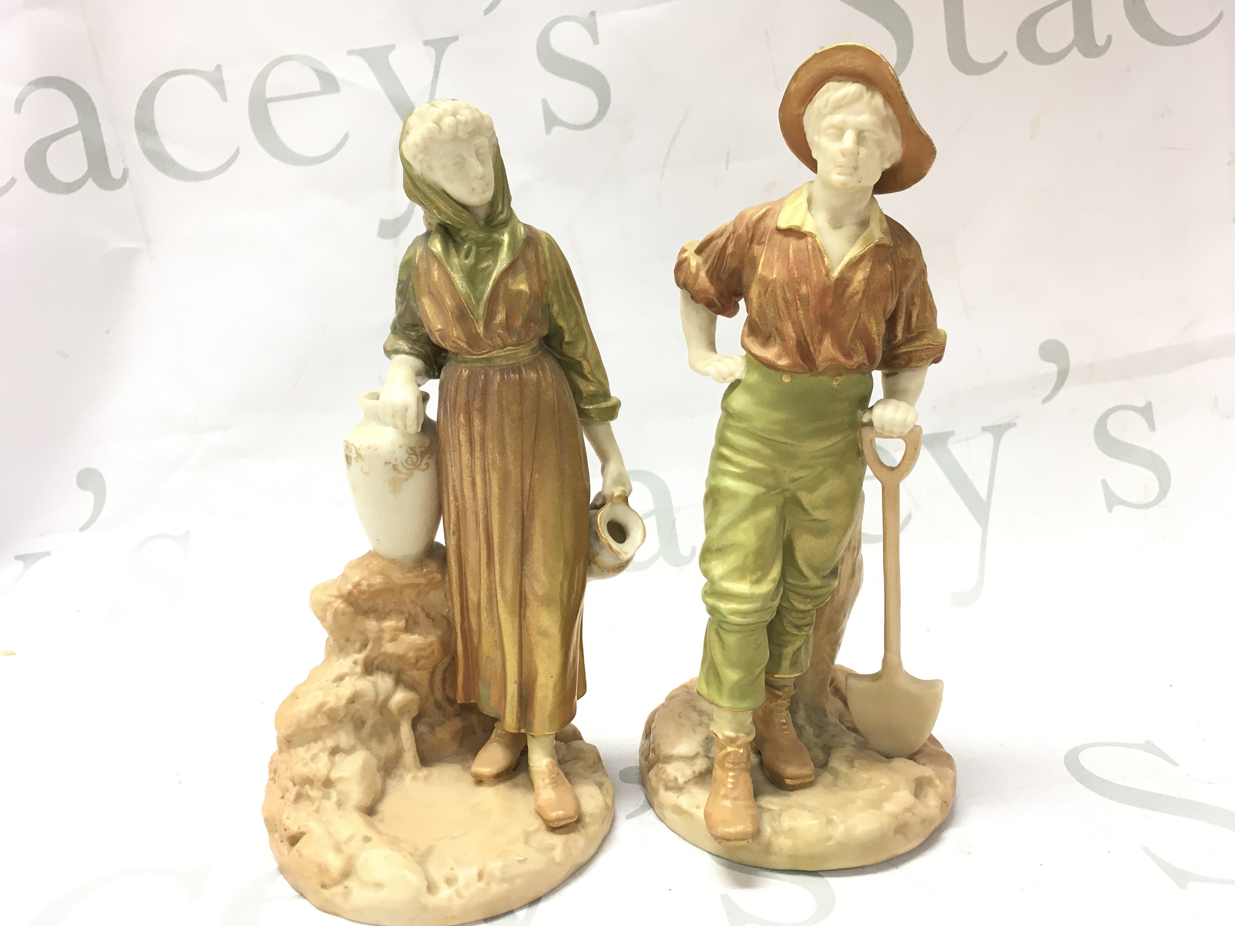 A pair of Royal Worcester James Hadley figures dated 1810, 18cm tall. This lot cannot be posted