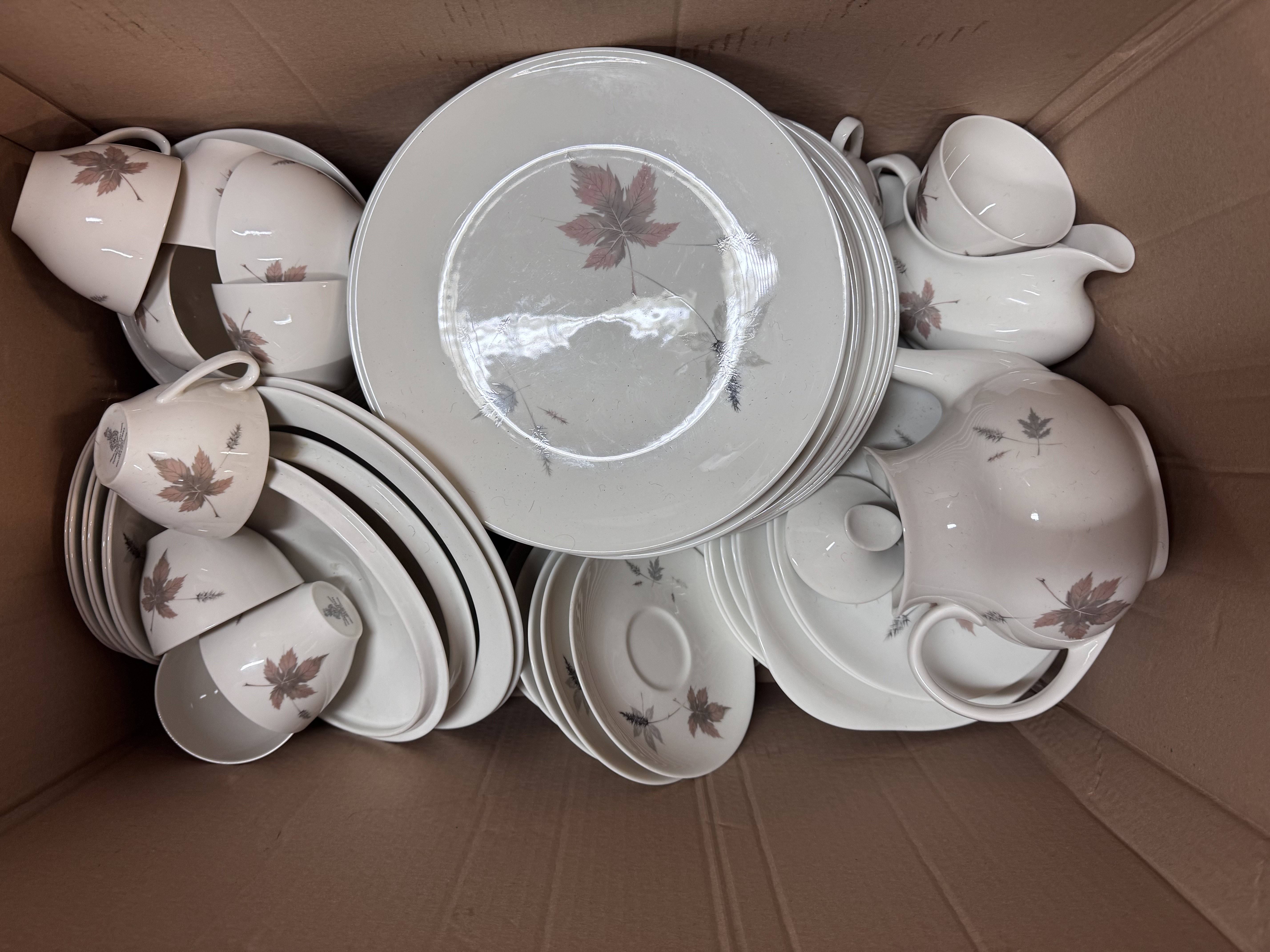 An extensive collection of Royal Doulton Tumbling leaves dinner and tea china.