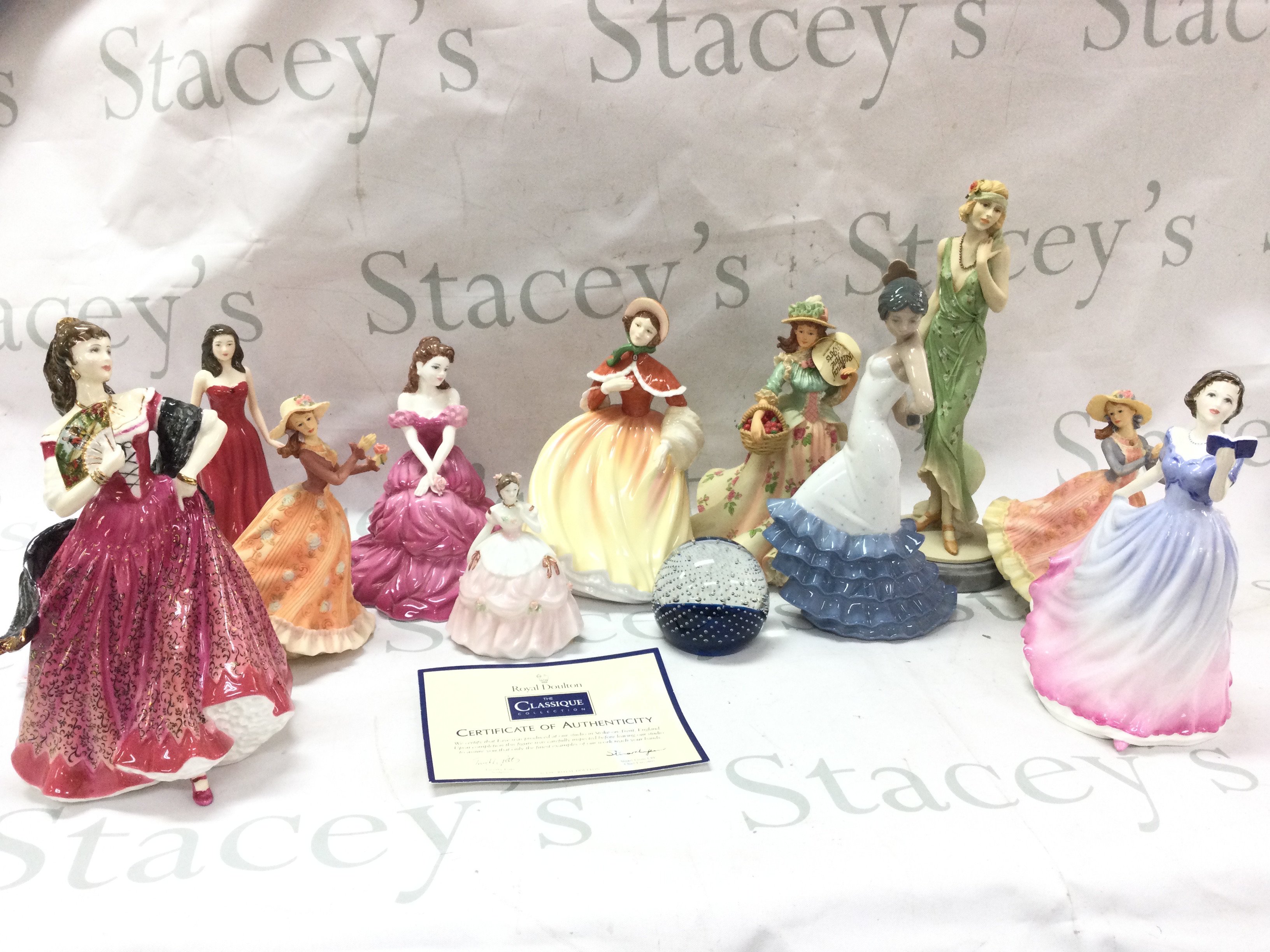 A collection of ceramic figures including Royal Doulton including figures Carmen HN3993, January Garnet HN 4970, Faye CL3984 , NAO, Leonardo ,Caithness paperweight etc. this lot cannot be posted