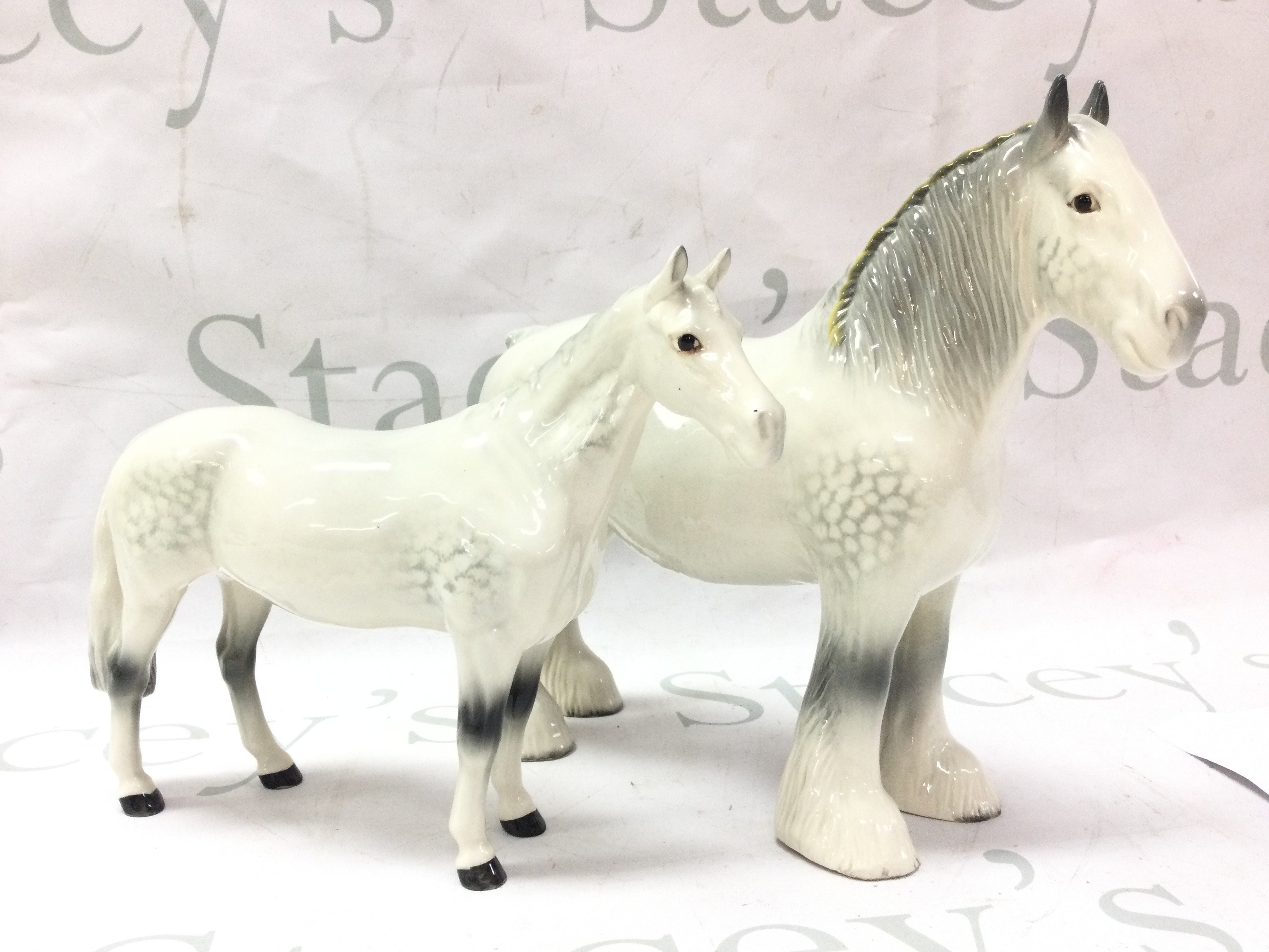 Two porcelain Beswick horse figures 17 and 21cm tall.this lot cannot be posted