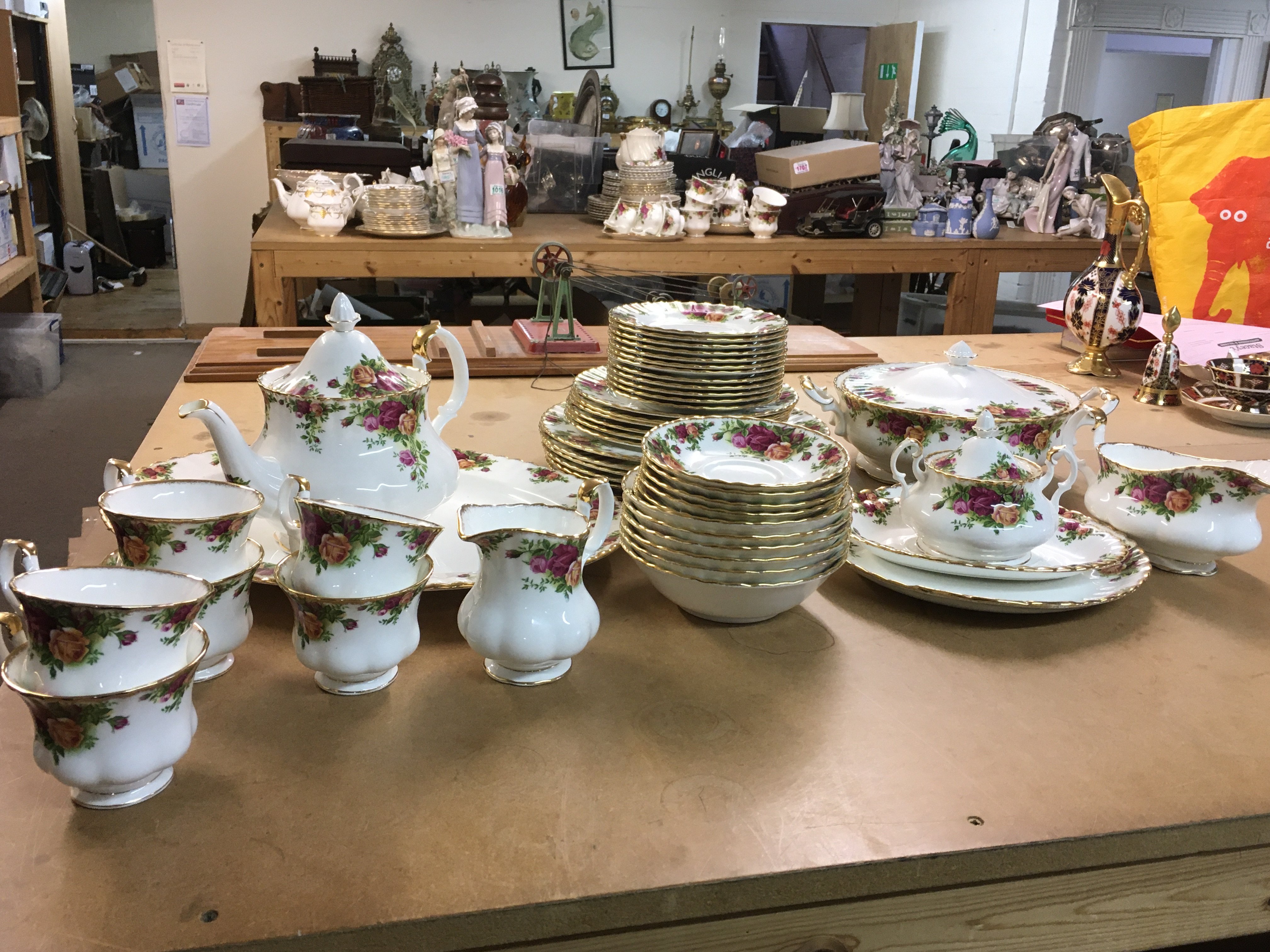 A Royal Albert Country Roses tea set including cups, saucers, tea pot, plates etc