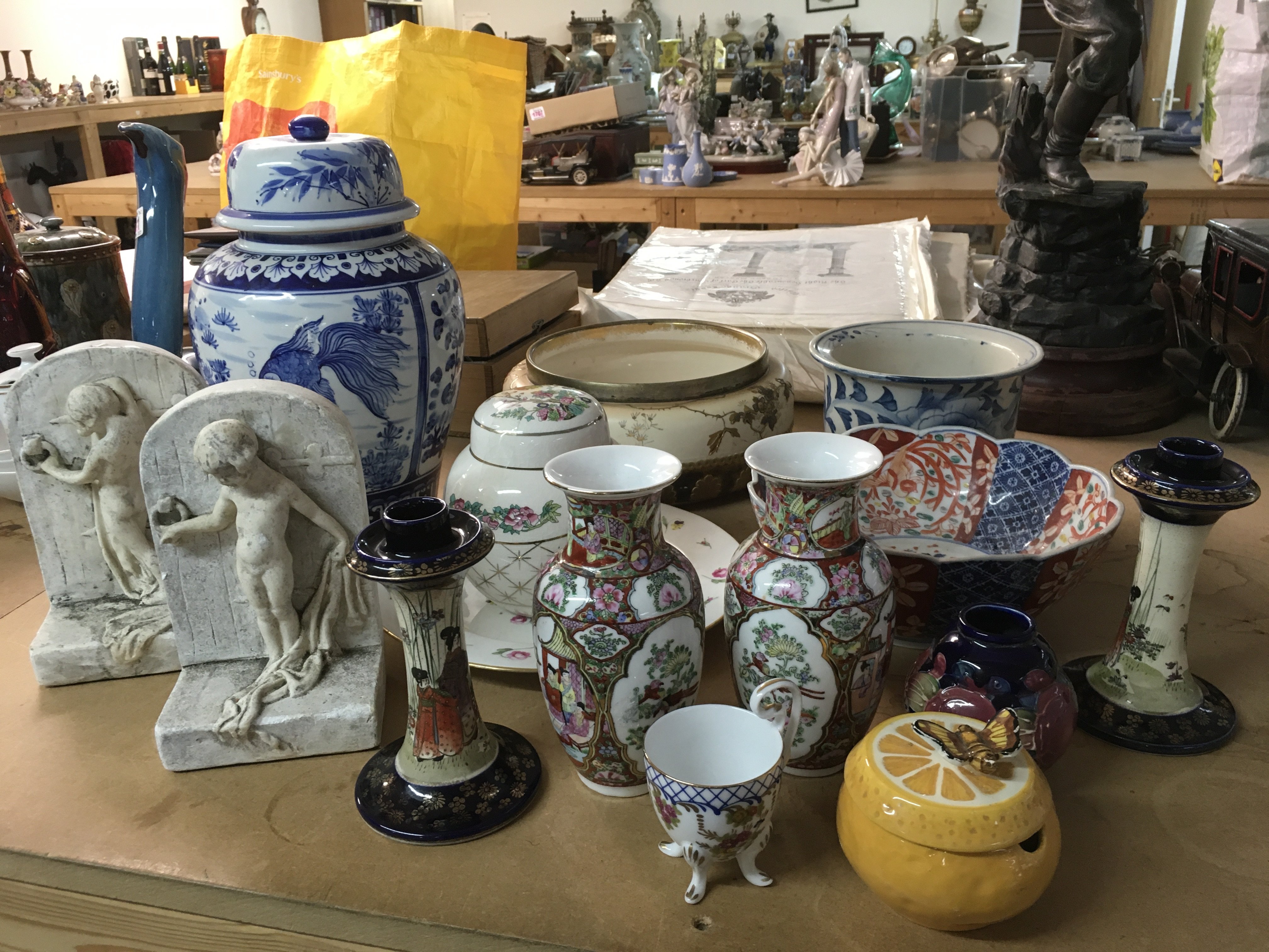 A collection of ceramics including Imari dish, blue and white vases, Famille rose style vases