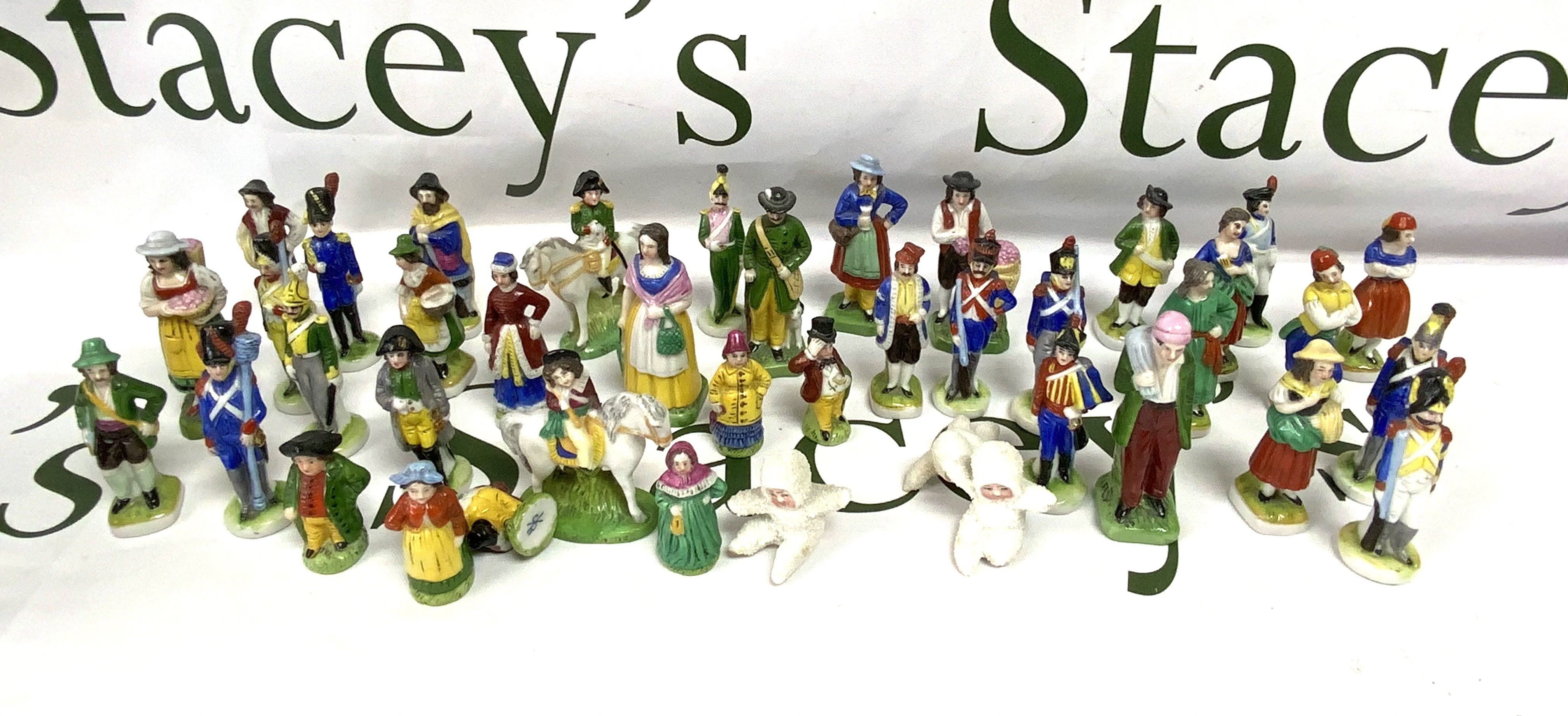 A collection of SCHEIBE ALSBACH porcelain figures, town folk/french military subjects including Napoleon. (39). Including 3 porcelain snow babies.