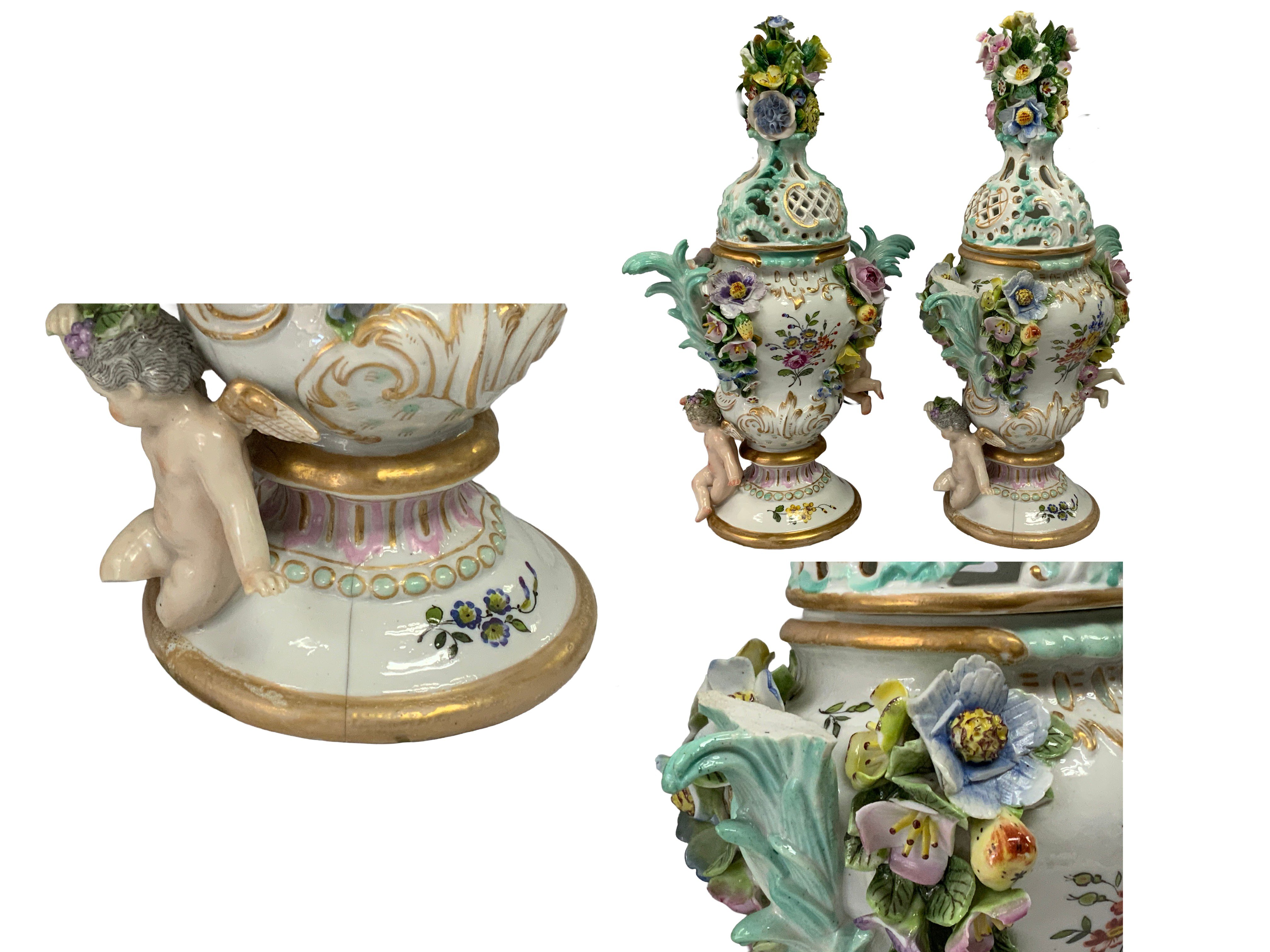A pair of 19th Century German porcelain pot pourri vases and covers with cherub and floral decoration. 36cm. (Some areas of damage).