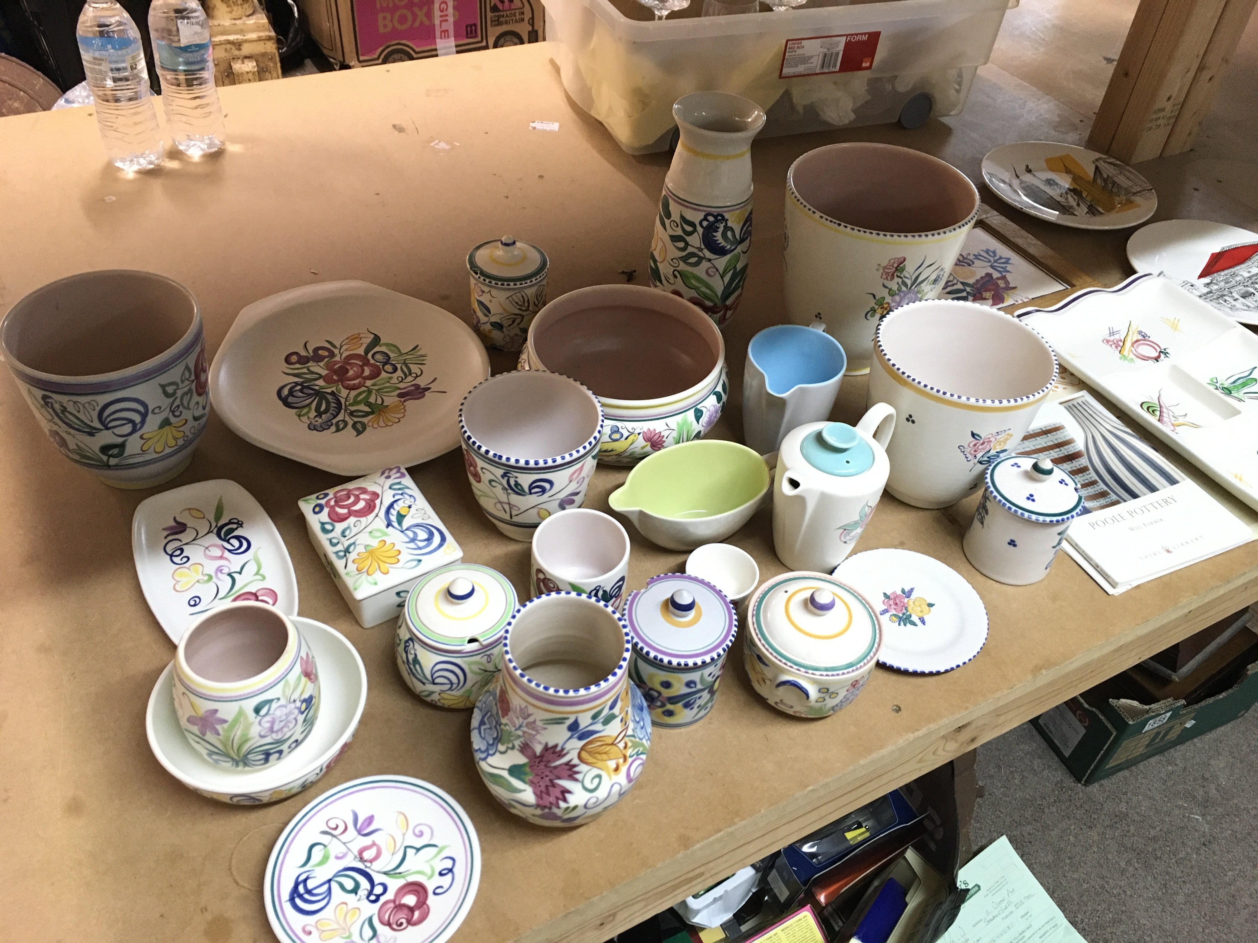 A collection of poole pottery including vases, dishes, containers, three cities in sketch plates etc