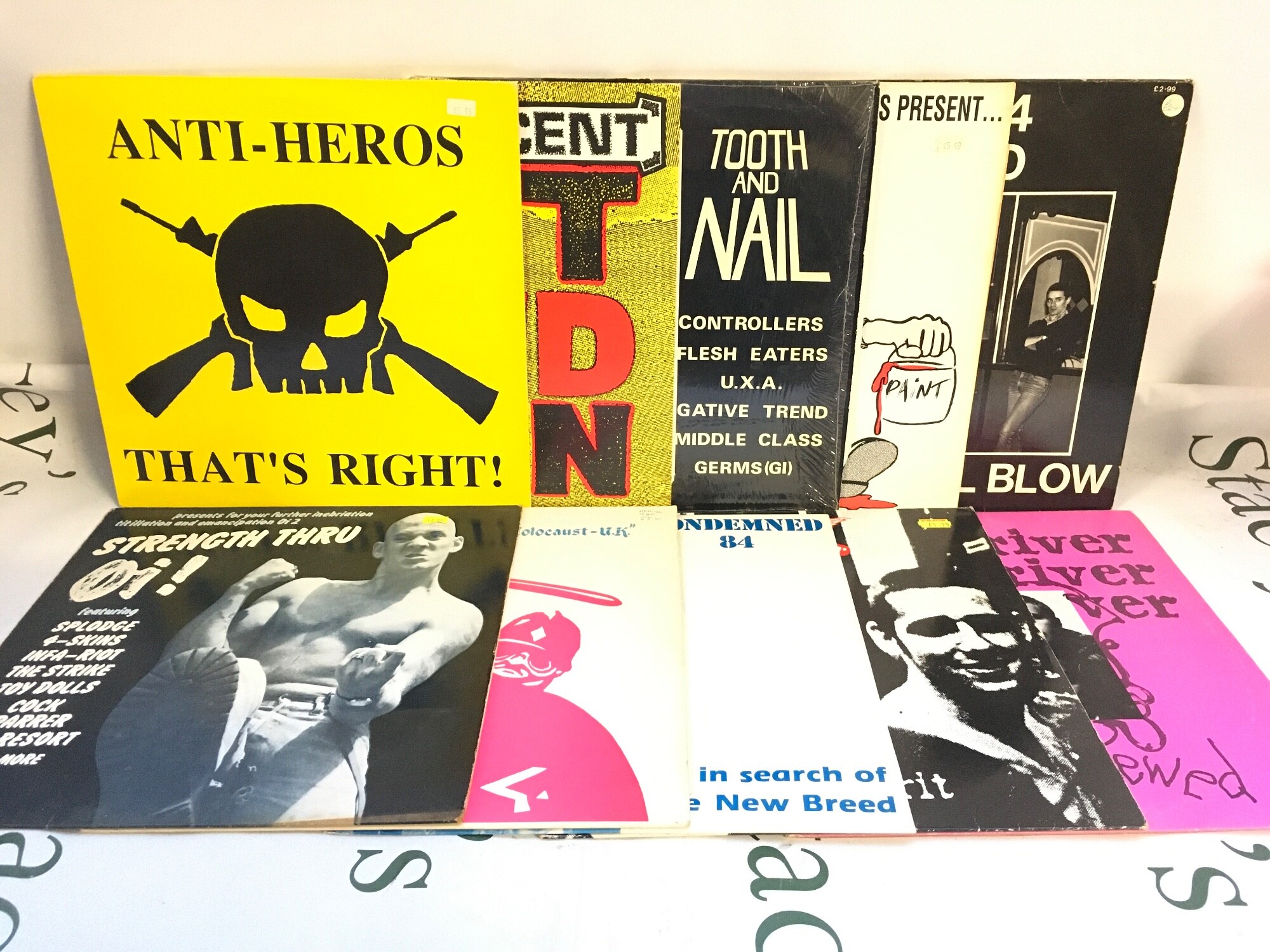 Ten punk /Oi LPs and 12" singles by various artists including Anti Heros, Skrewdriver, Cock Sparrer and others.