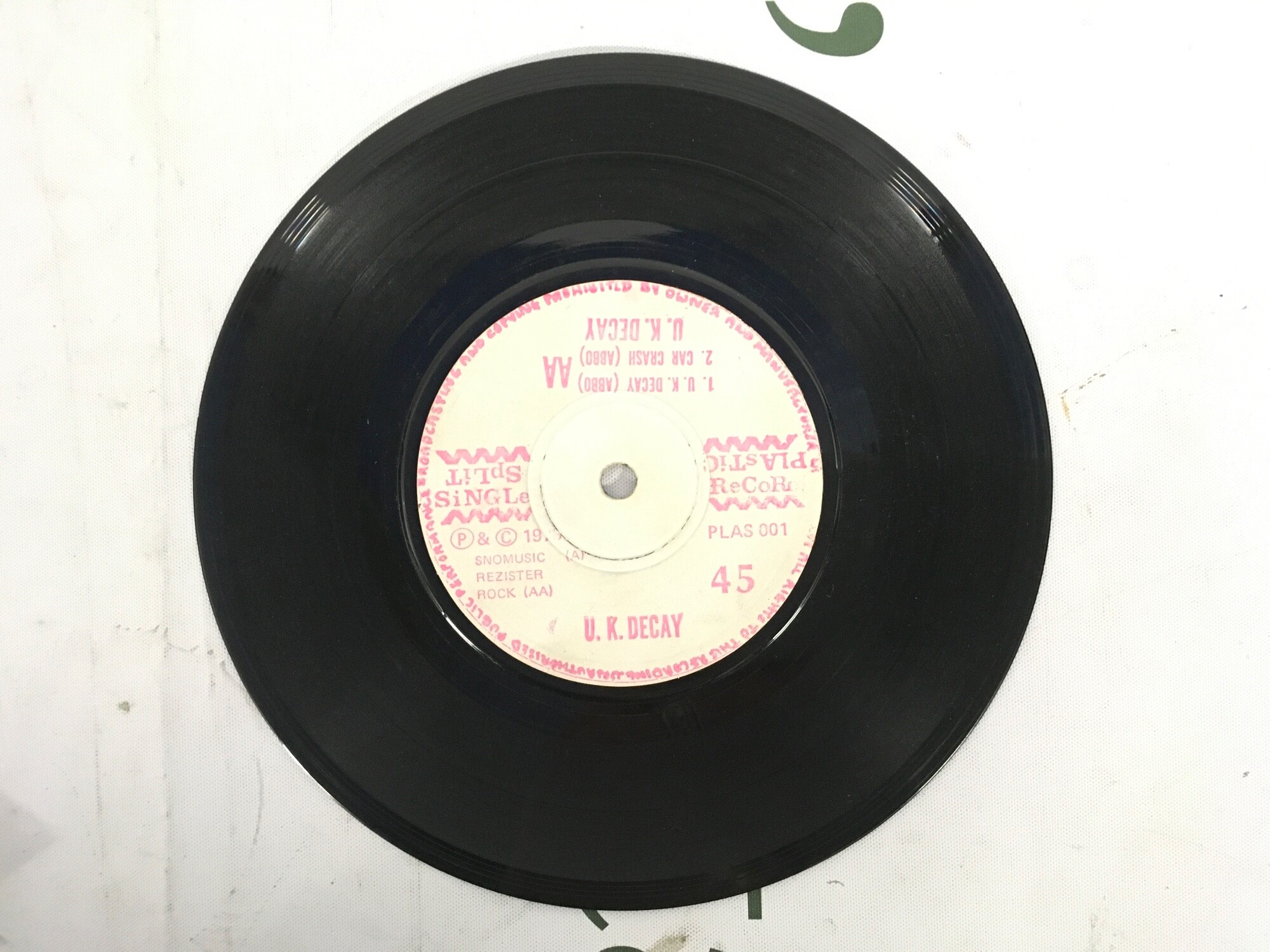 A 1979 split 7" single by UK Decay and Pneumania. Some surface marks and hairline scratches, no cover.