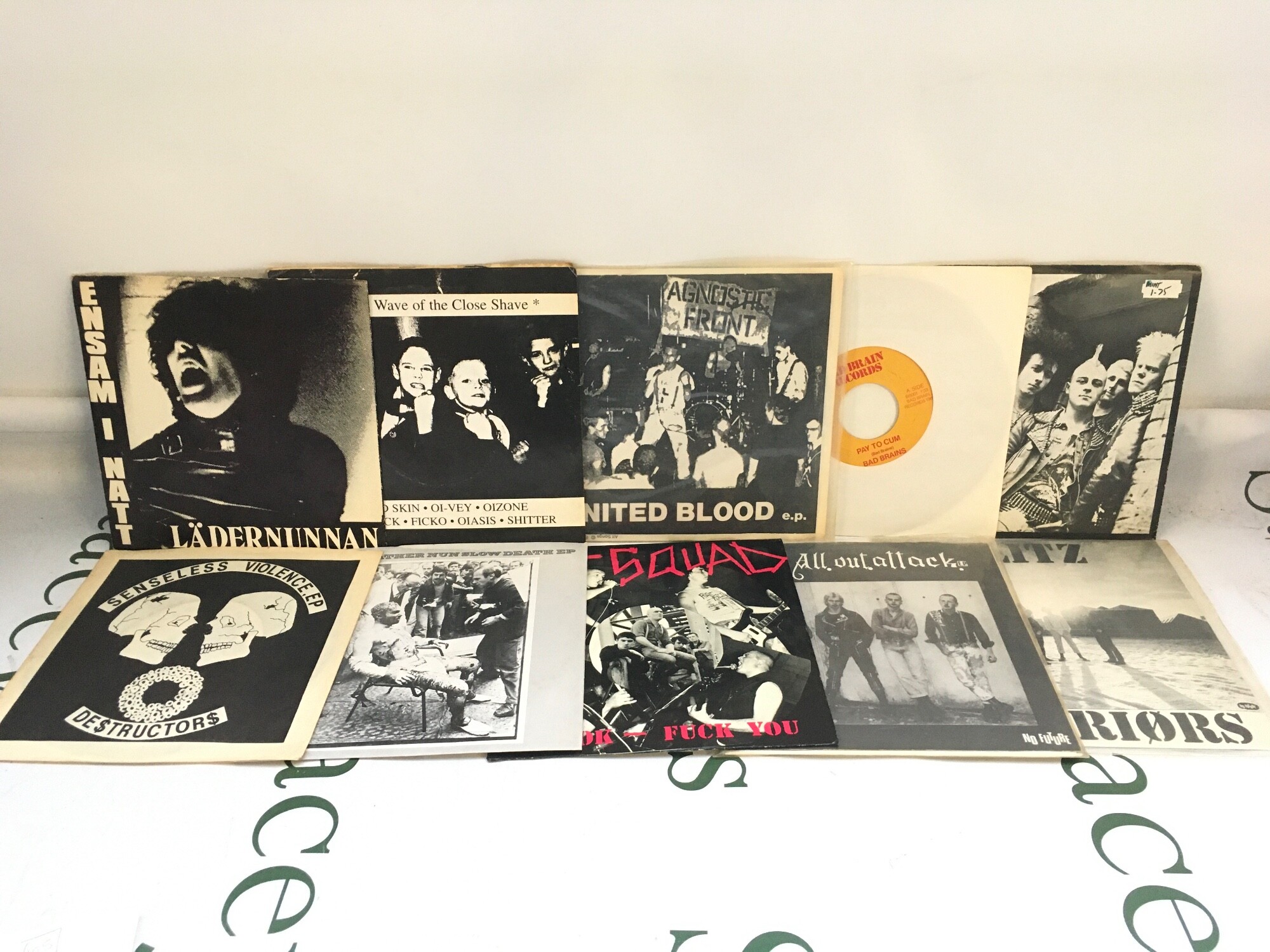 Ten punk 7" singles by various artists including Leather Nun, Agnostic Front, Riot Squad and others.