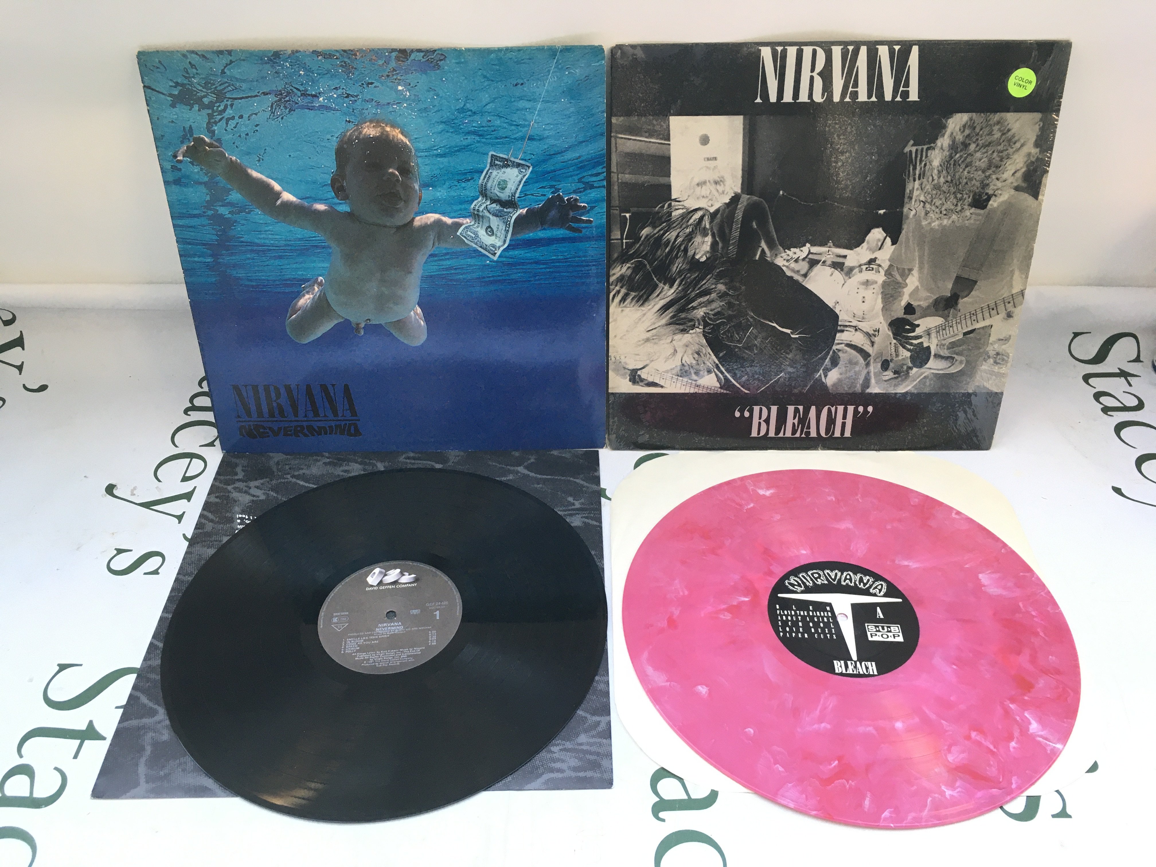 Two Nirvana LPs comprising a first European pressing of Nevermind and a pink marbled pressing of Bleach. Both EX/EX.