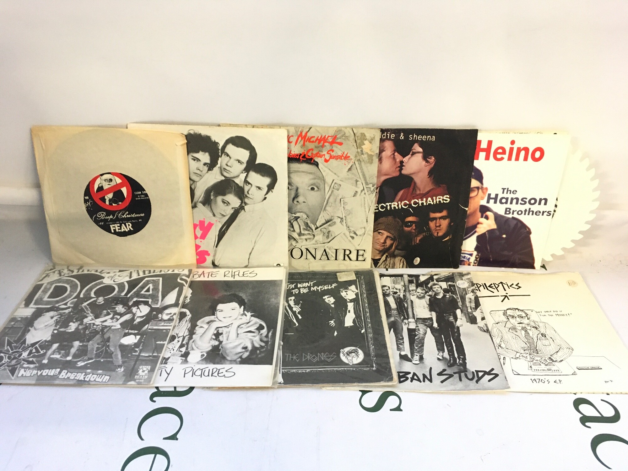 Ten punk and alt rock 7" singles by various artists including The Drones, The Epileptics, Fear and others.