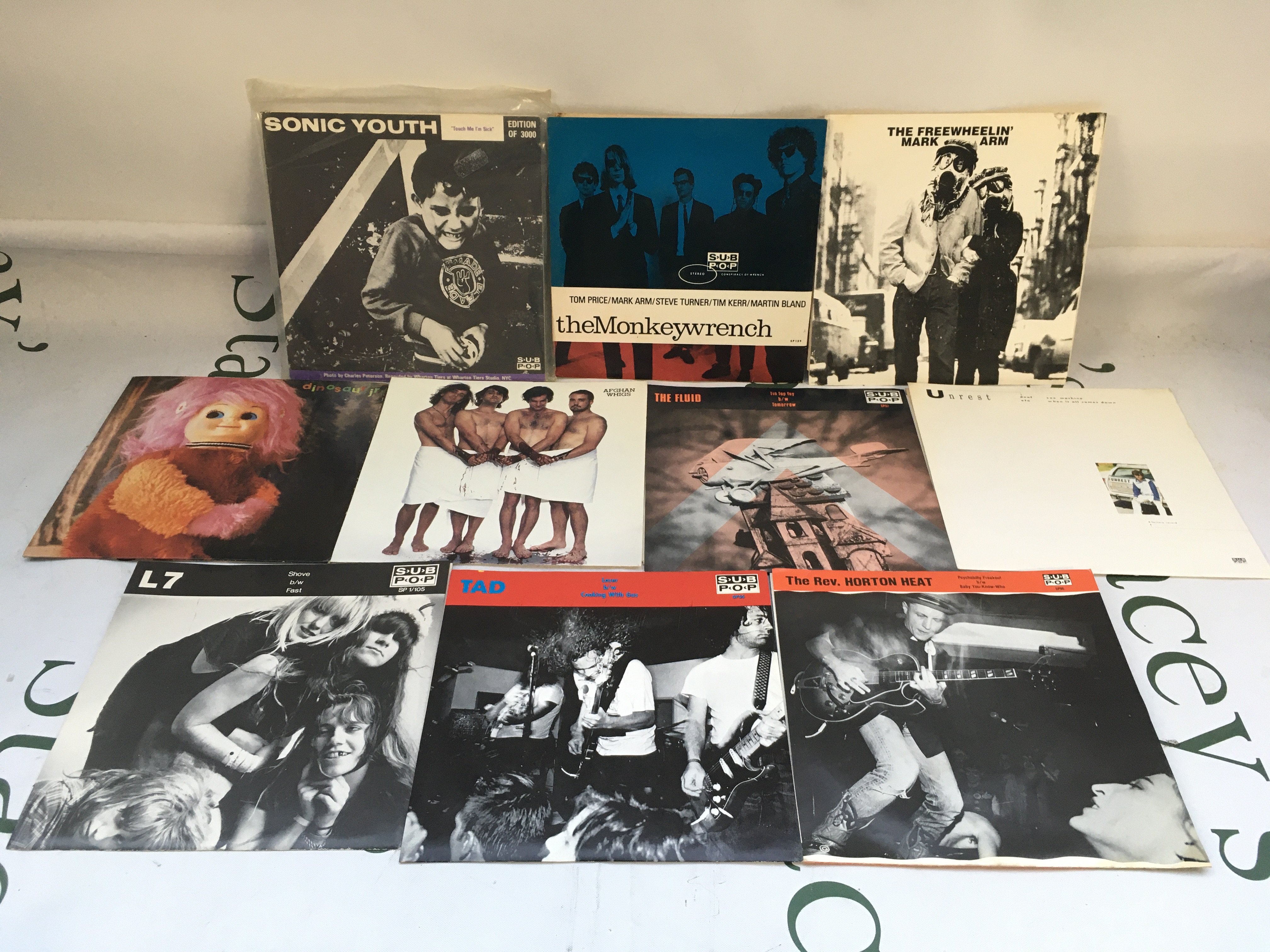 Ten Sub Pop 7" singles by various artists including Sonic Youth, Dinosaur Jr, Tad and others.