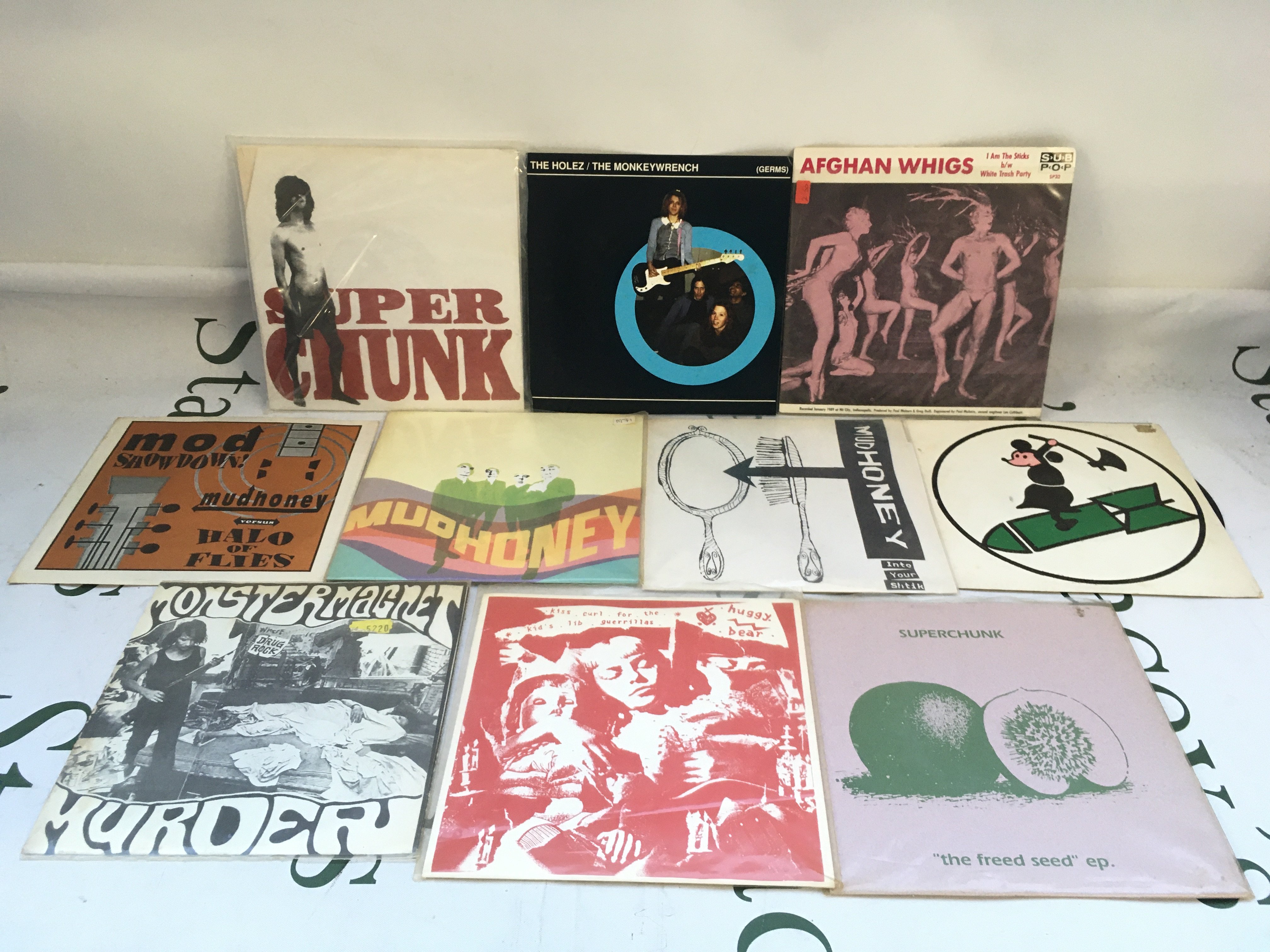 Ten grunge 7" singles by various artists including Mudhoney, Afghan Whigs, Superchunk and others.