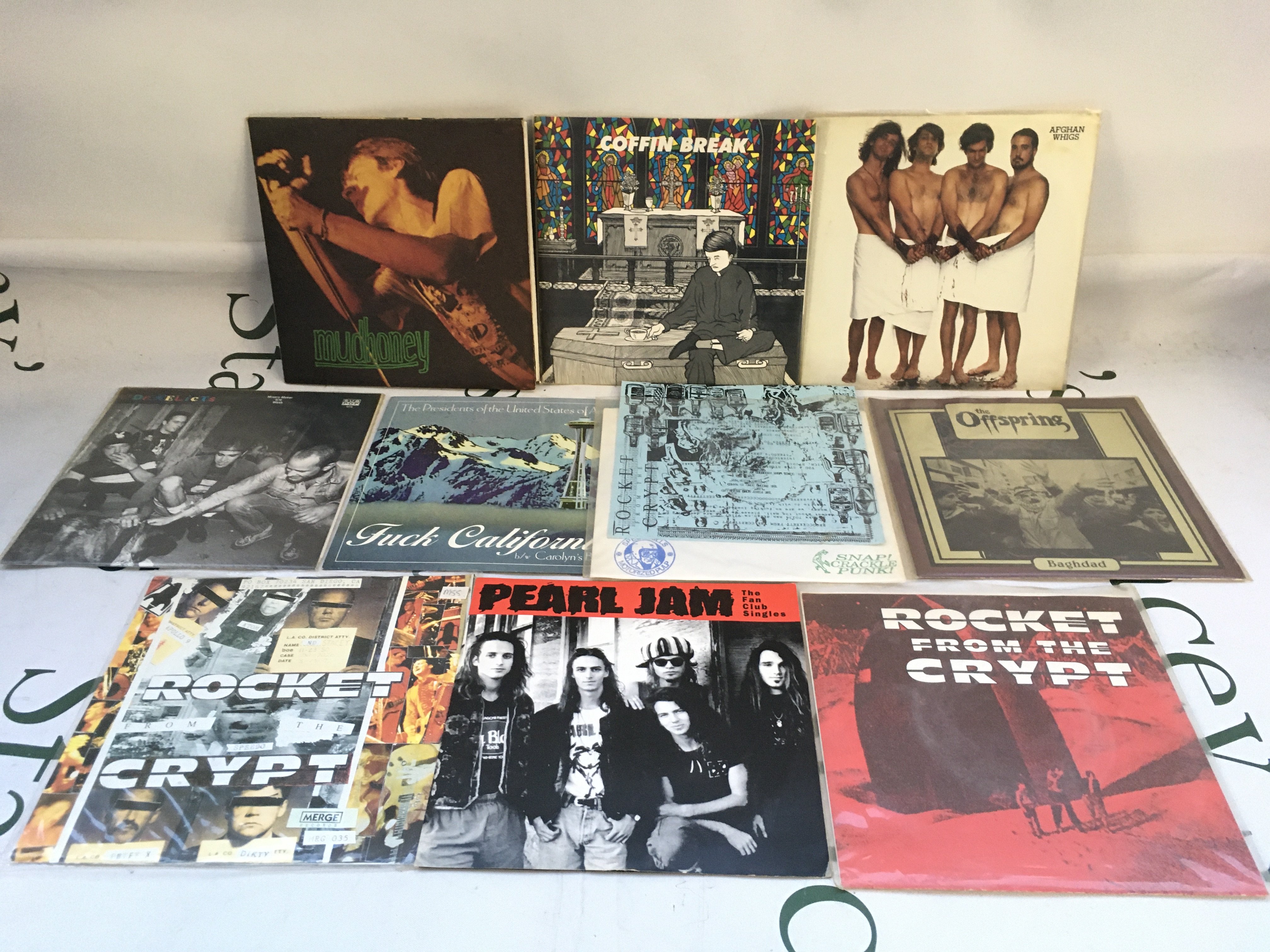 Ten grunge 7" singles and EPs by various artists including Pearl Jam, Mudhoney, Rocket From The Crypt and others.