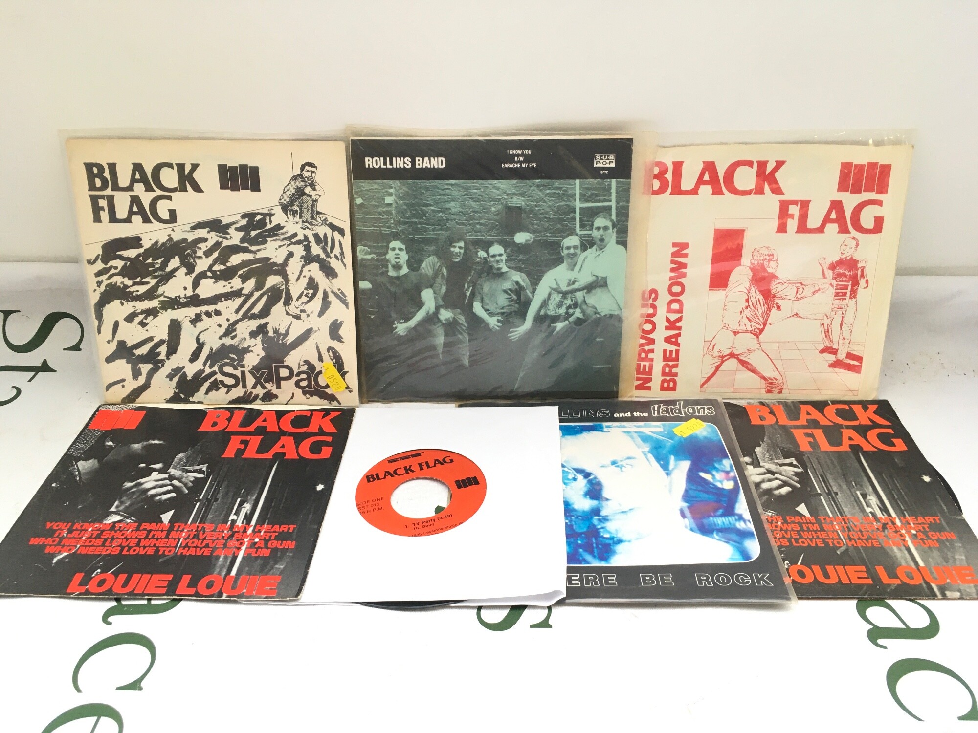 A collection of Black Flag and Henry Rollins 7" singles and EPs.