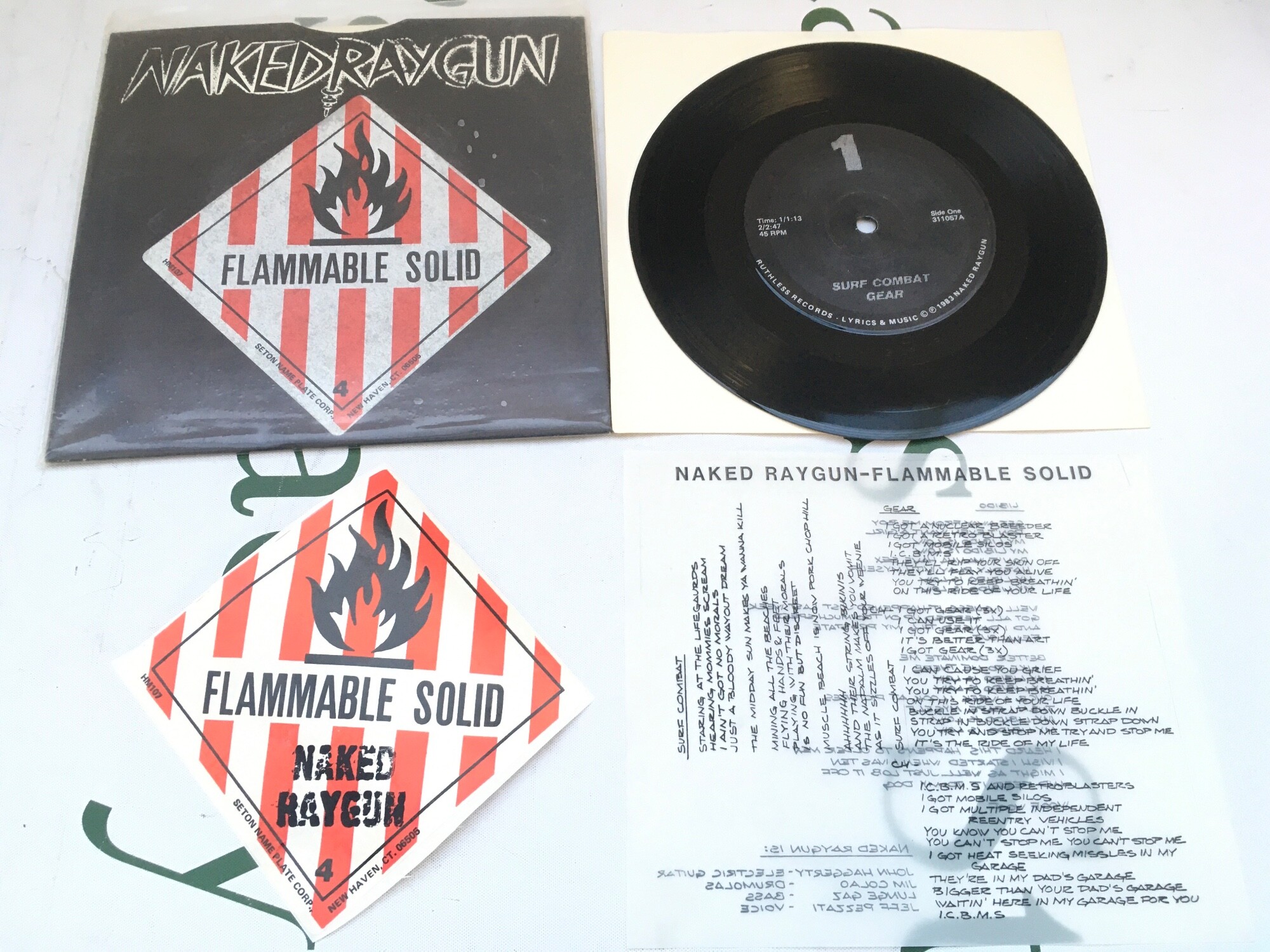A first pressing 7" single of Flammable Solid by Naked Raygun complete with inserts. EX/EX.