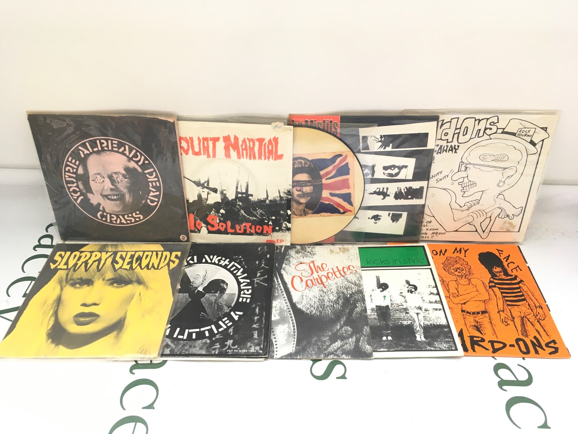 Ten punk 7" singles by various artists including Sex Pistols, Hard Ons, Crass and others.