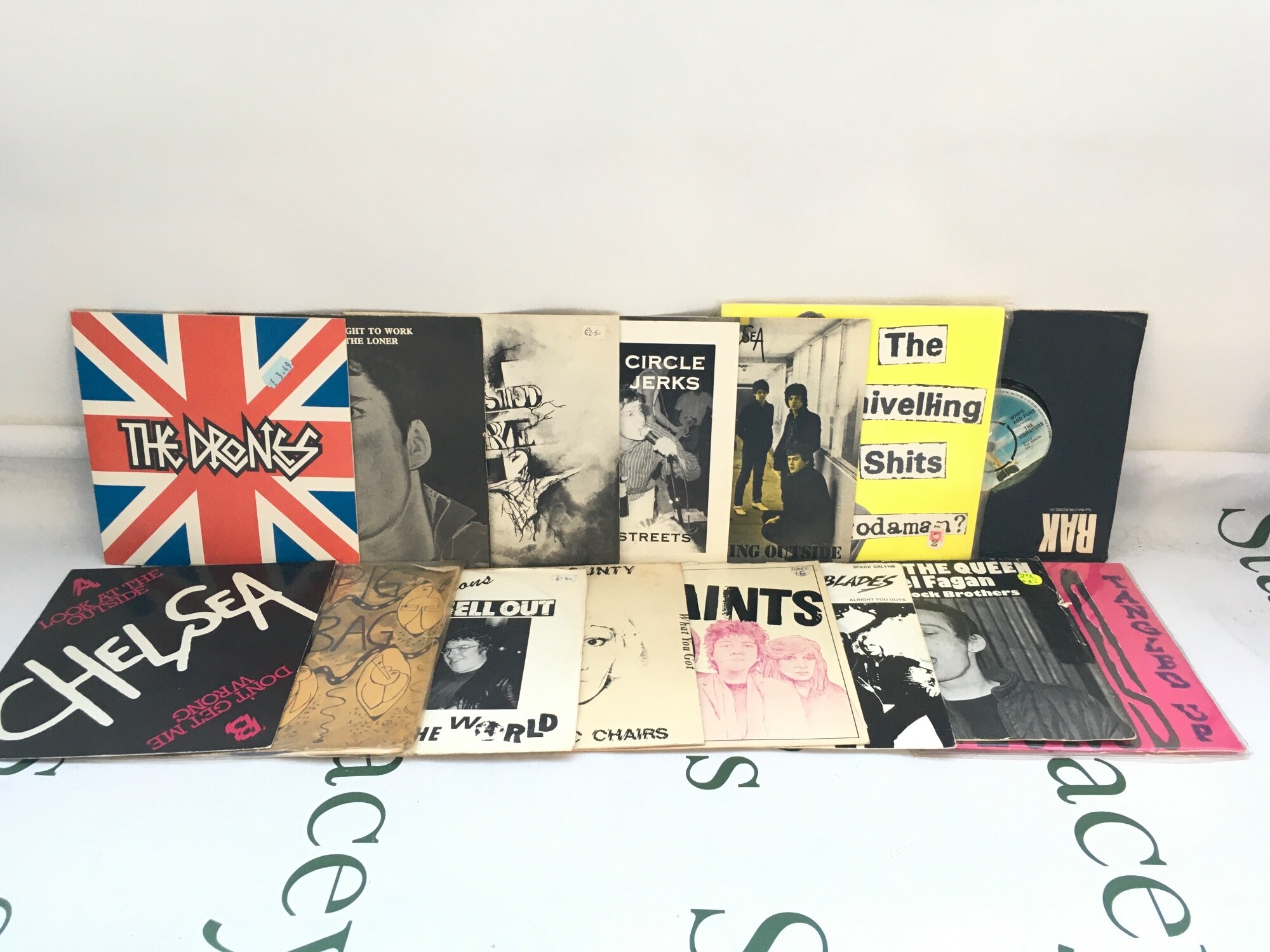 Thirty punk 7" singles by various artists including Circle Jerks, Twisted Nerve, Vibrators and others.
