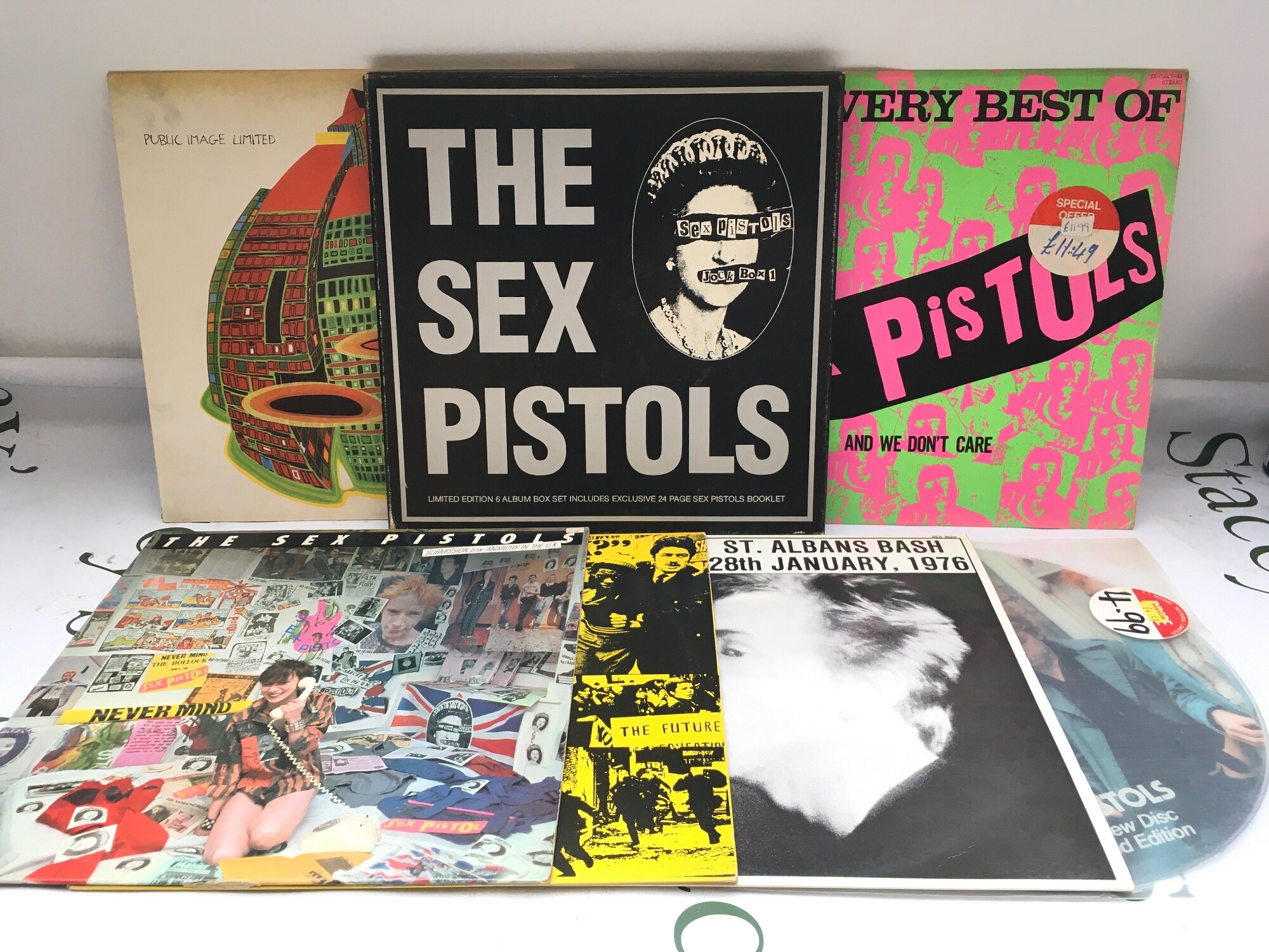 Seven Sex Pistols and related LPs and 12" singles.