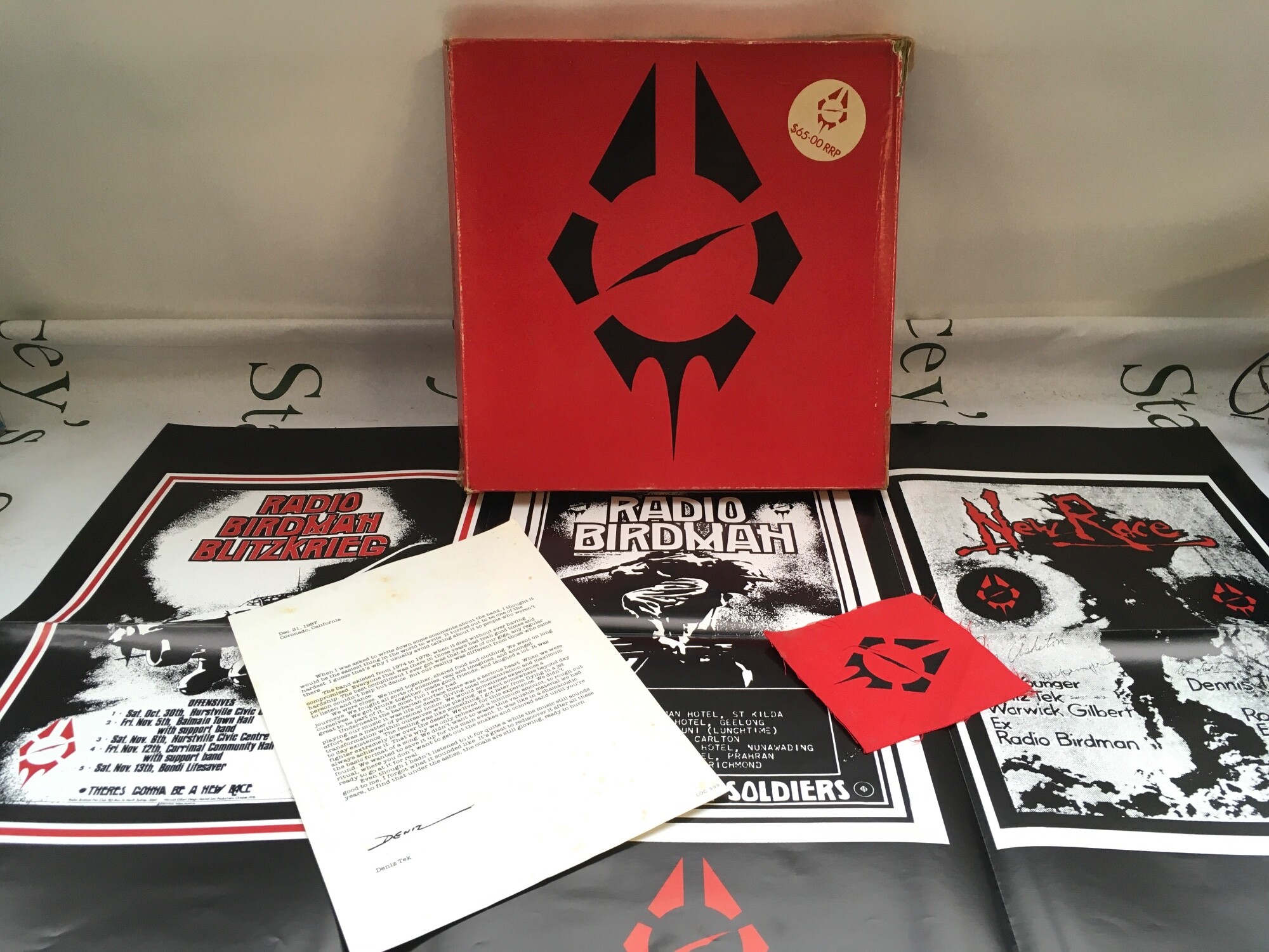 A Radio Birdman multi LP/EP/7" box set with inserts. Box damaged.