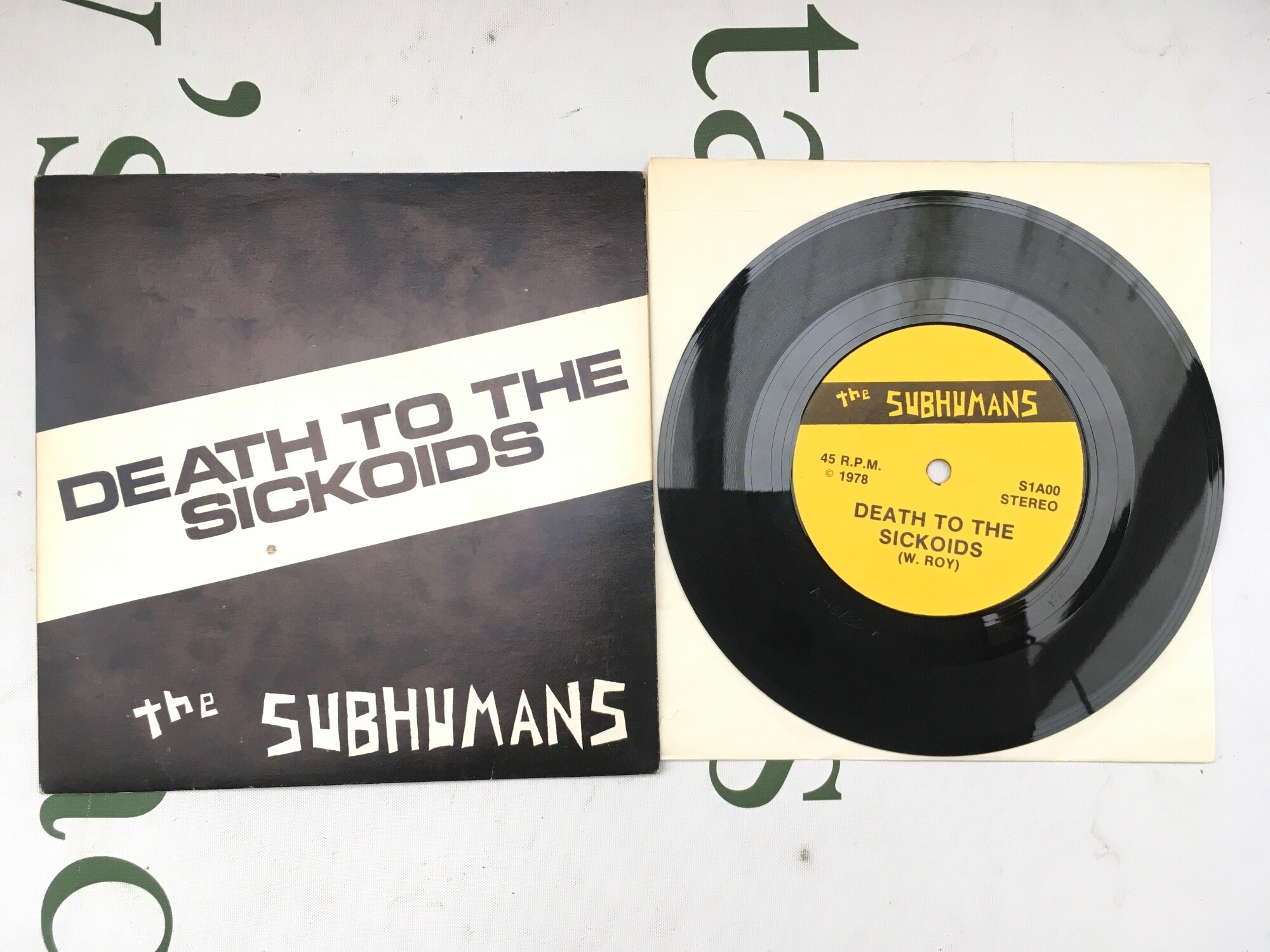 A first Canadian pressing of The Subhumans - Death To The Sickoids 7" single. Vinyl EX.