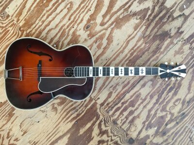 A circa 1940s/50s jazz archtop guitar likely to have been built by Armin Paulus. A similar cutaway version was used by Elvis Presley when he was stationed in Germany whilst on National Service. Has had some restoration with replacement tuners, nut, tailpiece and bridge. No case.