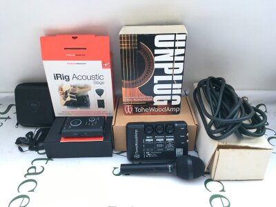 A boxed Tonewood Amp acoustic guitar effects unit, a boxed iRig acoustic stage mic system for acoustic guitar and an AKG D80 microphone and lead (3).