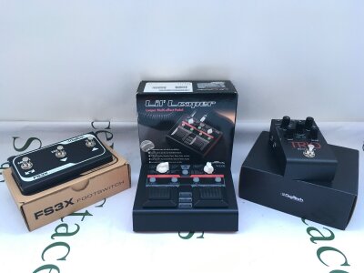 A boxed Vox Lil Looper multi effects pedal, a boxed Trio V-02 band creator and a boxed Digitech FS3X foot switch (3).