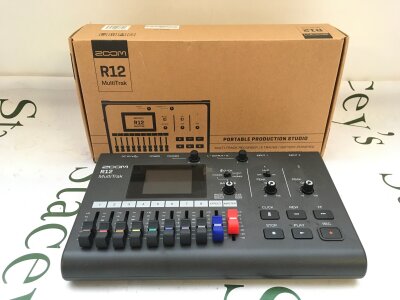 A boxed Zoom R12 multiTrak portable production studio.
